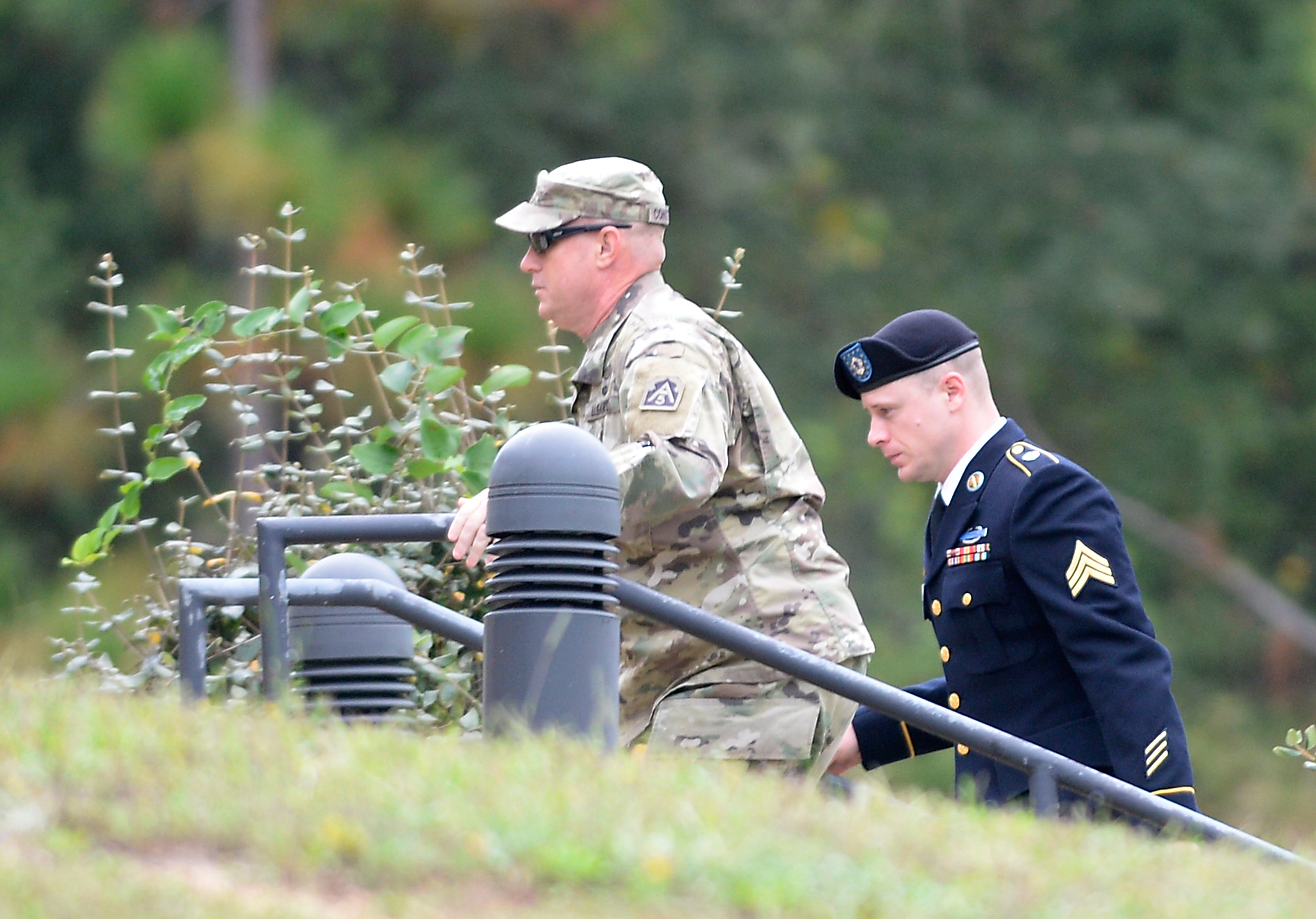 U.S. Army Sgt. Robert Bowdrie "Bowe" Bergdahl (right) is escorted into the Ft. Bragg military courthouse for a motions hearing on October 16, 2017 in Fort Bragg, North Carolina. Bergdahl faces charges of desertion and endangering troops stemming from his decision to leave his outpost in 2009, which landed him five years in Taliban captivity. (Credit: Sara D. Davis/Getty Images)