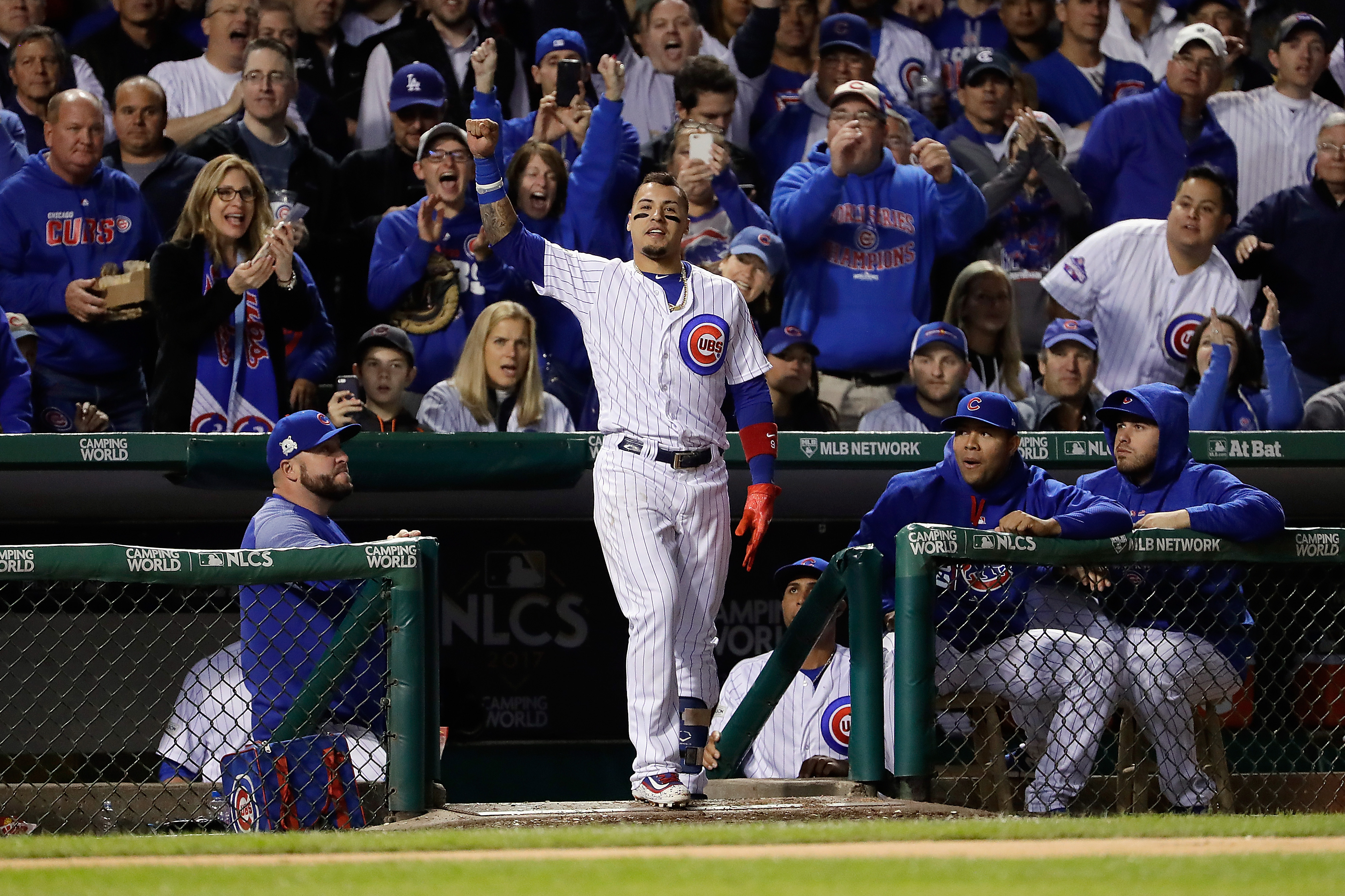 Javier Baez of the Chicago Cubs takes a curtain call after hitting a home run in the fifth inning against the Los Angeles Dodgers during game four of the National League Championship Series at Wrigley Field on October 18, 2017 in Chicago. (Credit: Jamie Squire/Getty Images)