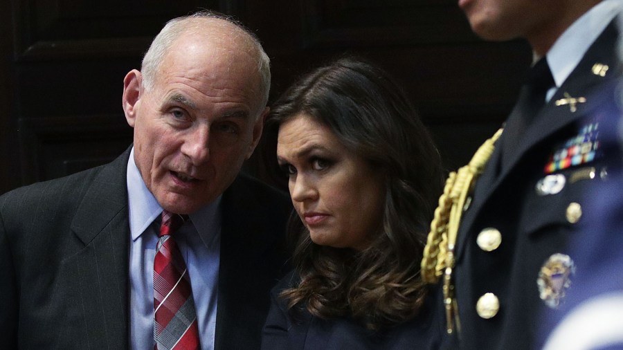 White House Chief of Staff John Kelly, left, and White House Press Secretary Sarah Sanders listen during a Roosevelt Room event Oct. 31, 2017, at the White House in Washington, D.C. (Credit: Alex Wong/Getty Images)