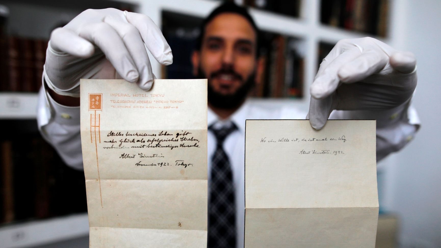 Two handwritten notes penned by Albert Einstein have been sold at auction for a combined $1.8 million. (Credit: Menahem Kahana/AFP/Getty Images)