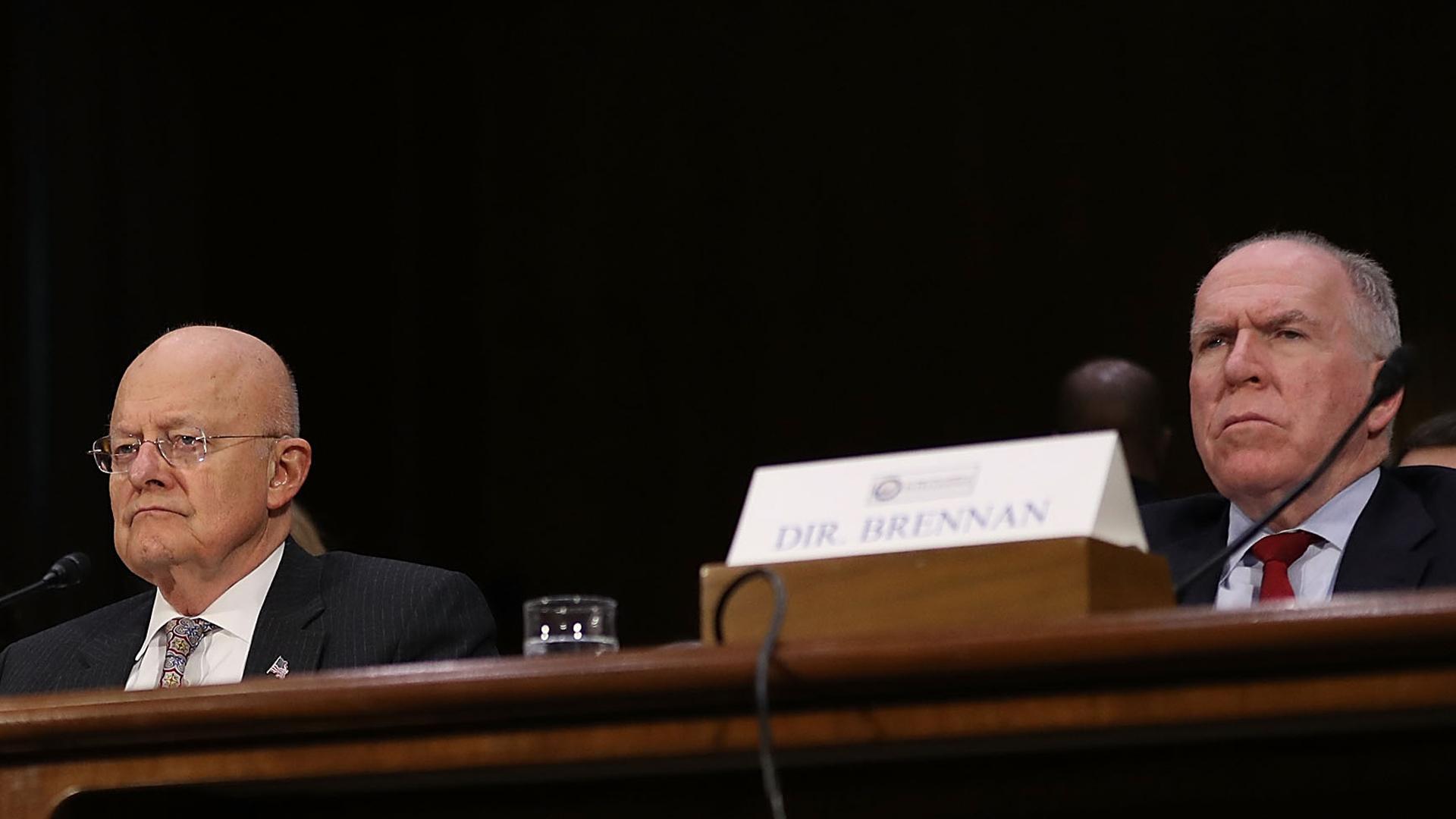 Former Director of National Intelligence James Clapper and former Central Intelligence Agency Director John Brennan (L-R) testify before the Senate Intelligence Committee in the Dirksen Senate Office Building on Capitol Hill Jan. 10, 2017, in Washington, D.C. (Credit: Joe Raedle/Getty Images)