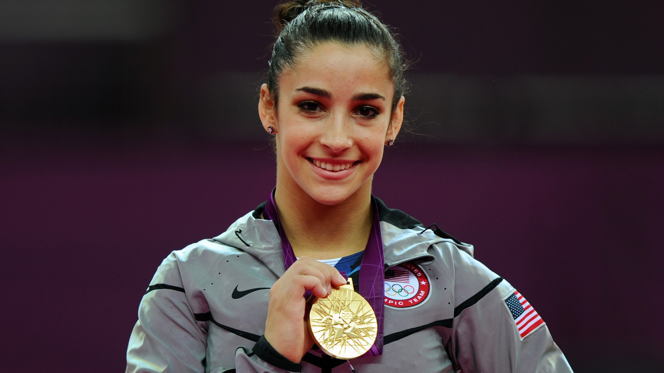 Gold medalist Alexandra Raisman poses on the podium on Day 11 of the London 2012 Olympic Games. (Credit: Michael Regan/Getty Images)