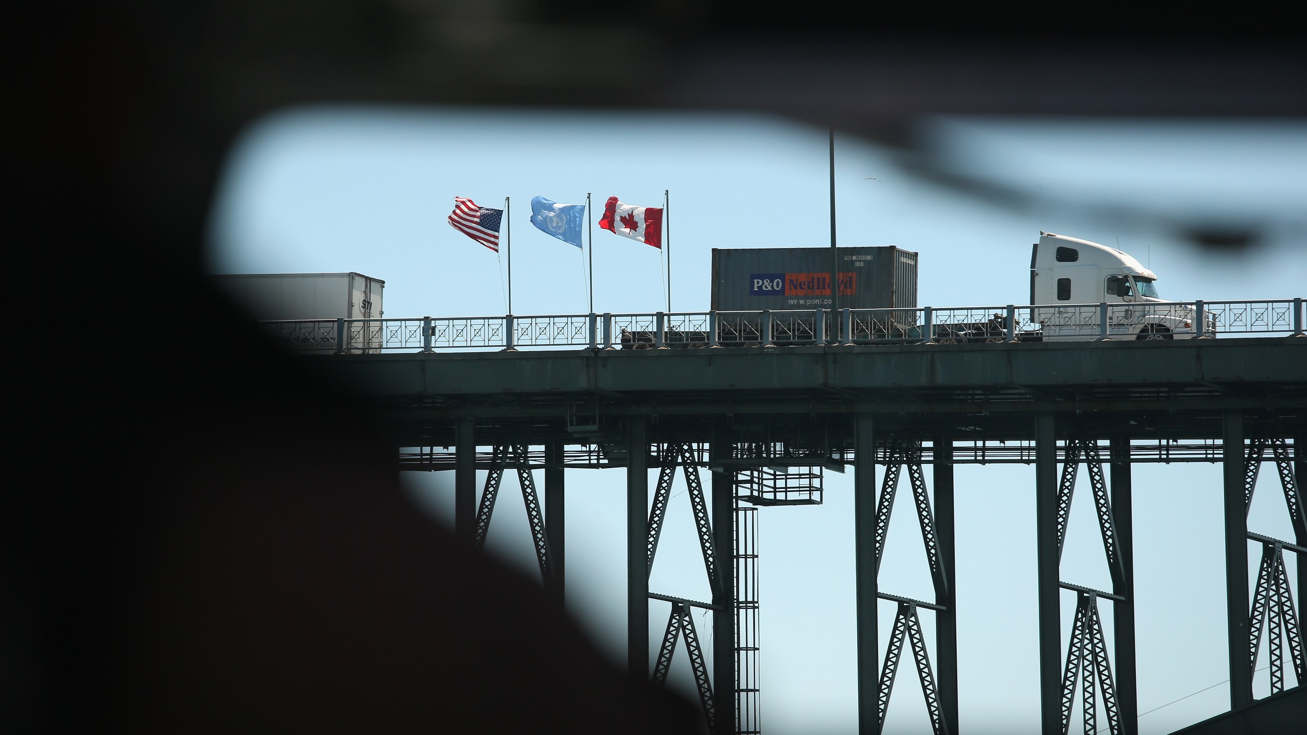 Freight crosses the Peace Bridge over the Niagara River forming the U.S.-Canada border on June 3, 2013, in Buffalo, New York. (Credit: John Moore / Getty Images)