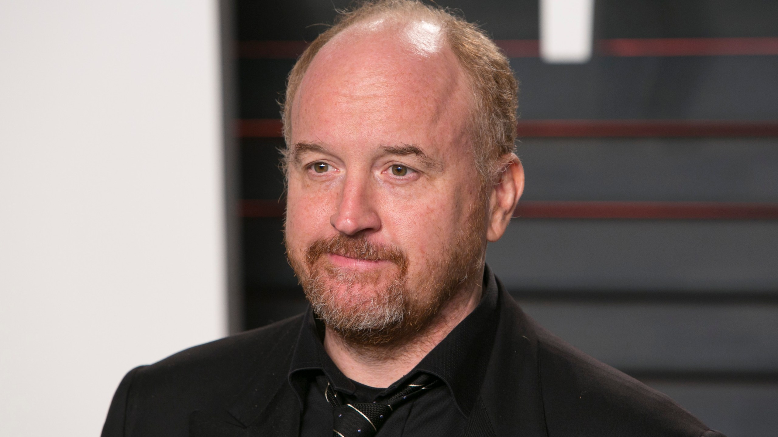 US comedian Louis C.K. poses as he arrives to the 2016 Vanity Fair Oscar Party in Beverly Hills, California on February 28, 2016. (Credit: ADRIAN SANCHEZ-GONZALEZ/AFP/Getty Images)