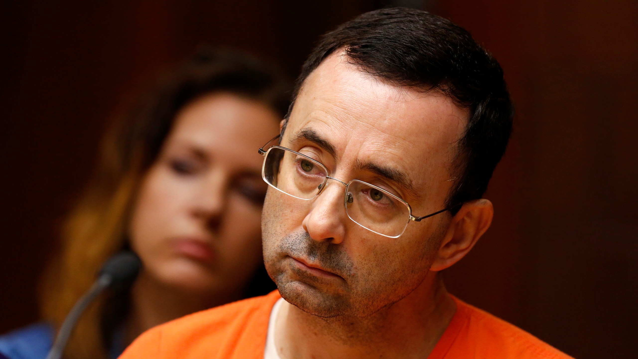 Former Michigan State University and USA Gymnastics doctor Larry Nassar is seen in the 55th District Court where Judge Donald Allen Jr. bound him over on June 23, 2017, in Mason, Michigan, to stand trial on 12 counts of first-degree criminal sexual conduct. (Credit: JEFF KOWALSKY/AFP/Getty Images)