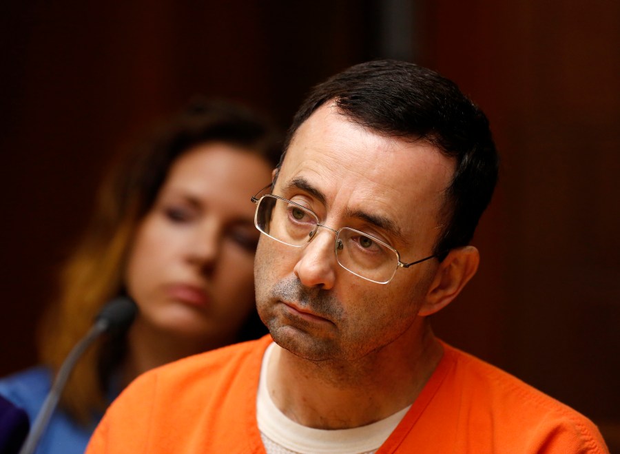 Former Michigan State University and USA Gymnastics doctor Larry Nassar is seen in the 55th District Court where Judge Donald Allen Jr. bound him over on June 23, 2017, in Mason, Michigan, to stand trial on 12 counts of first-degree criminal sexual conduct. (Credit: JEFF KOWALSKY/AFP/Getty Images)