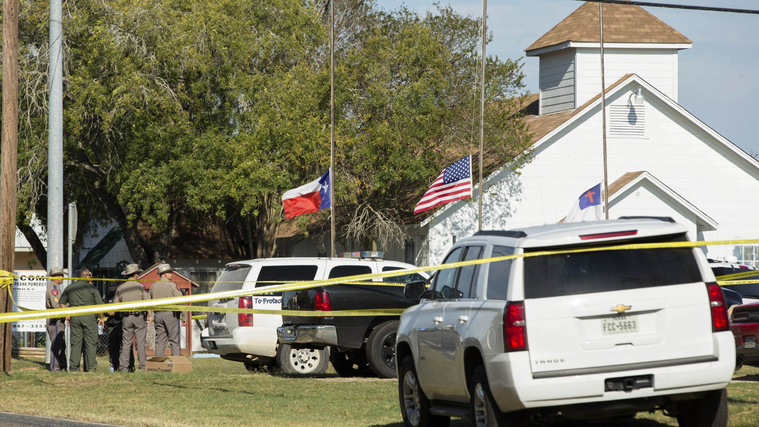 Law enforcement officials gather near the First Baptist Church in Sutherland Springs, Texas, where a gunman killed several people on Nov. 5, 2017. (Credit: Erich Schlegel / Getty Images)