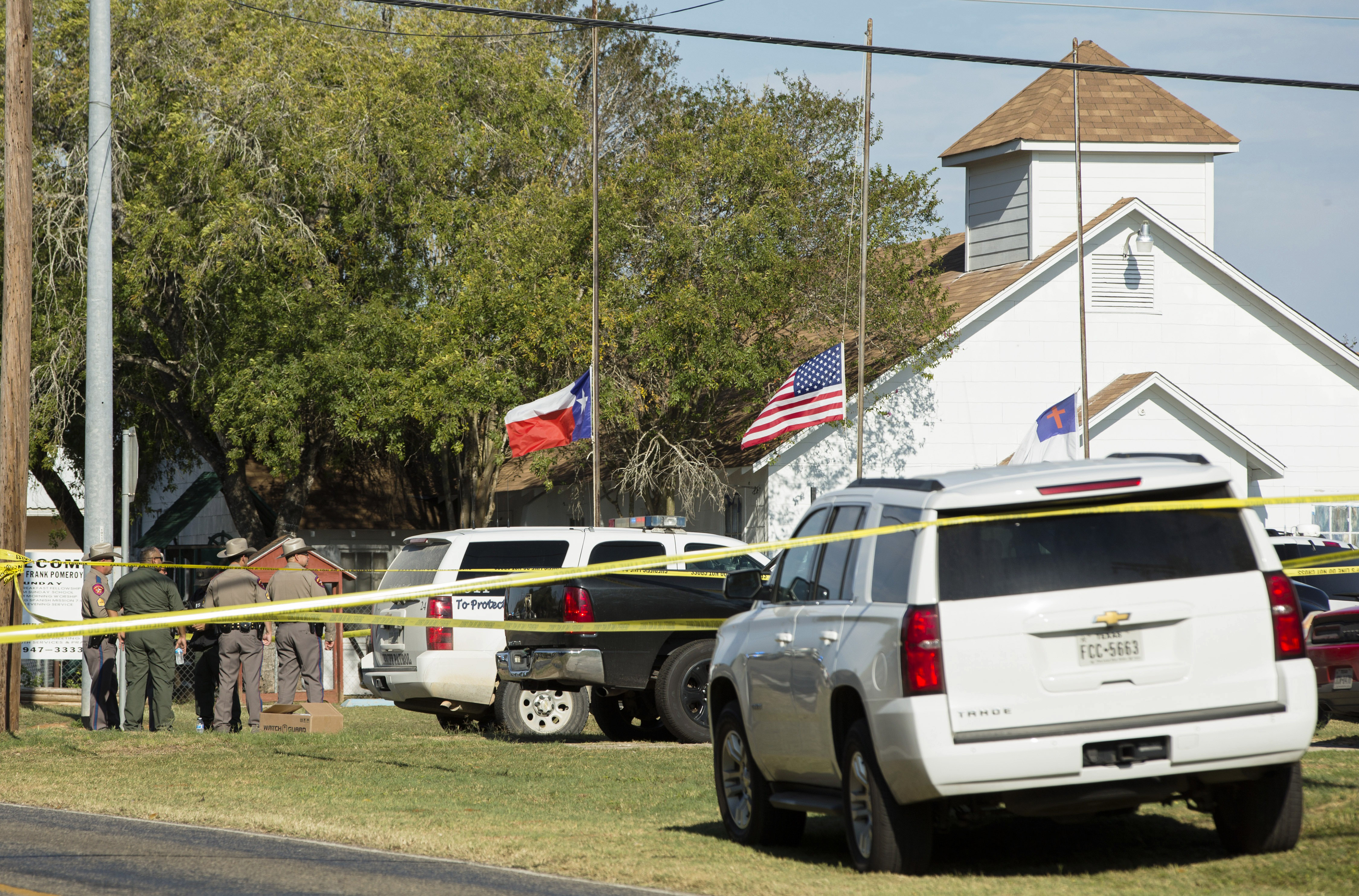 Law enforcement officials gather near the First Baptist Church in Sutherland Springs, Texas, where a gunman killed several people on Nov. 5, 2017. (Credit: Erich Schlegel / Getty Images)