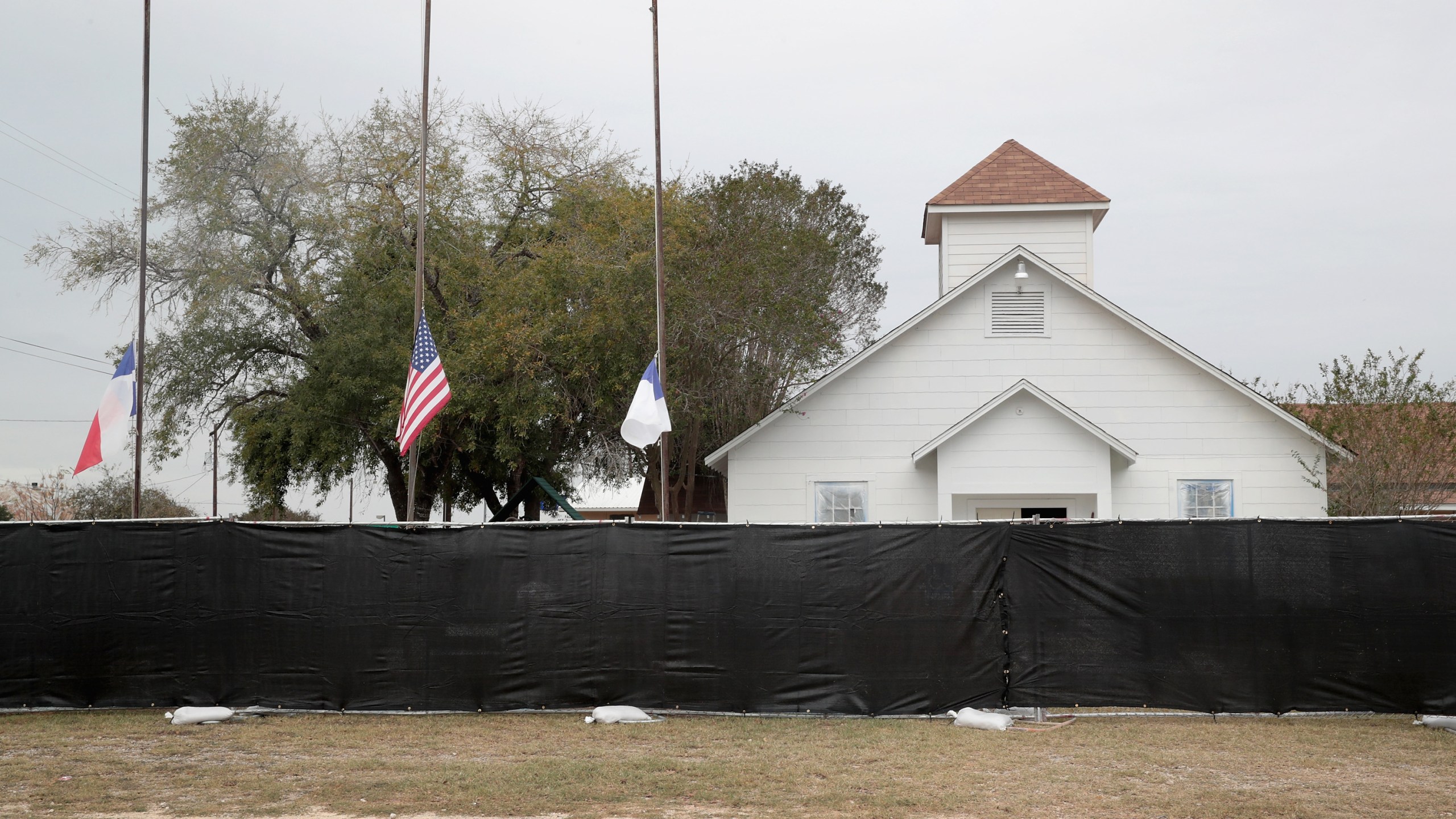 A tarp is wrapped around the First Baptist Church of Sutherland Springs as law enforcement officials wrap up their investigation into the shooting on Nov. 9, 2017, in Sutherland Springs, Texas. (Credit: Scott Olson/Getty Images)