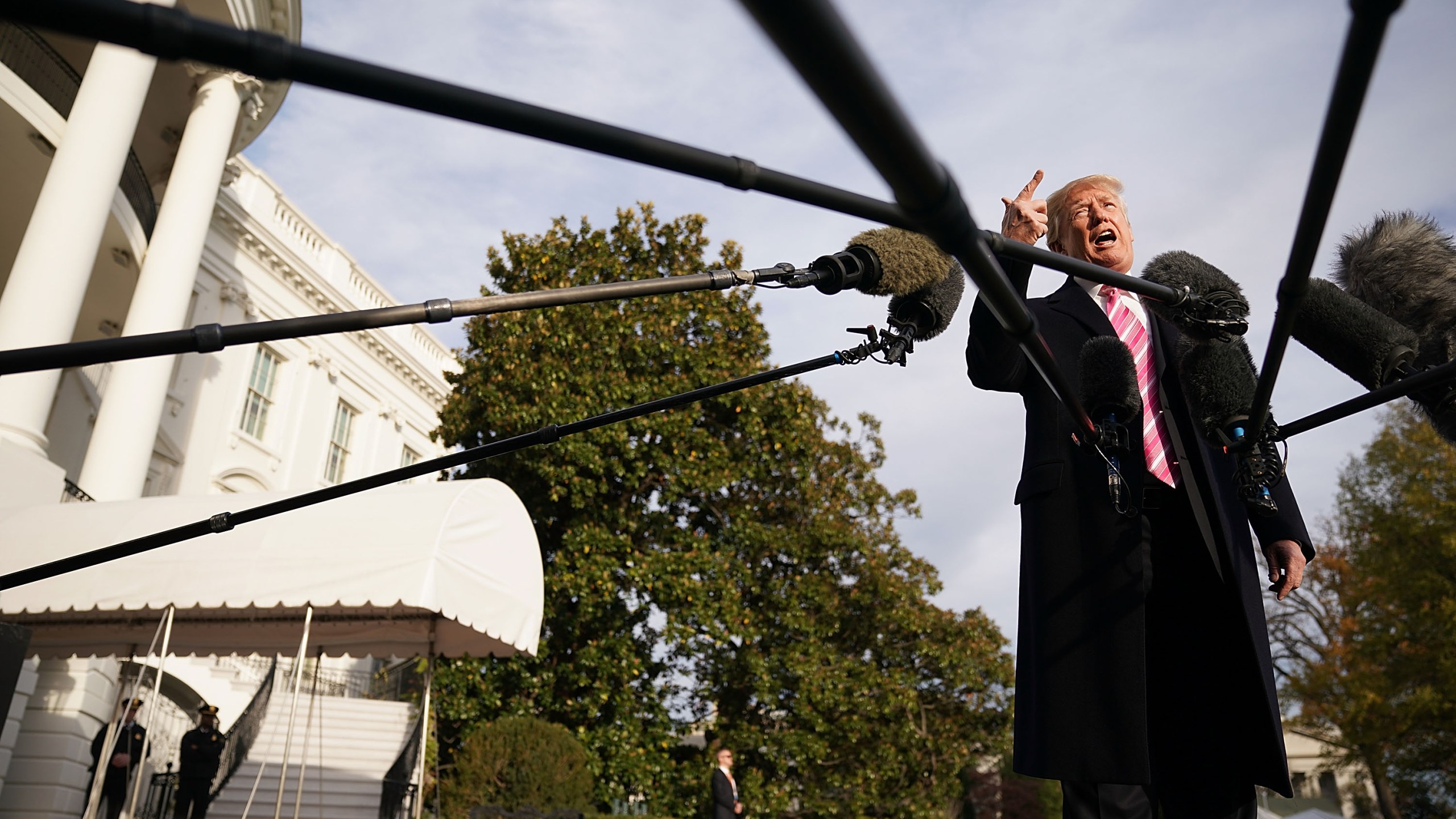 U.S. President Donald Trump talks to reporters as he departs the White House Nov. 21, 2017. (Credit: Chip Somodevilla / Getty Images)