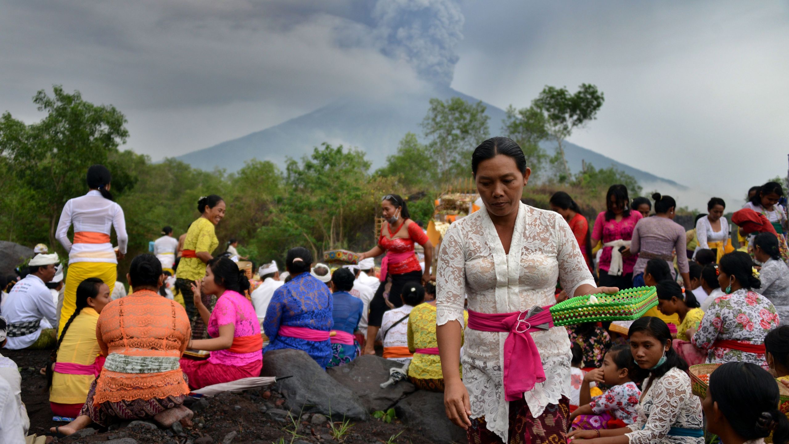 Balinese Hindus take part in a ceremony, where they pray near Mount Agung in hope of preventing a volcanic eruption, in Muntig village on Indonesia's resort island of Bali, Nov. 26, 2017. (Credit: Sonny Tumbelaka / AFP / Getty Images)