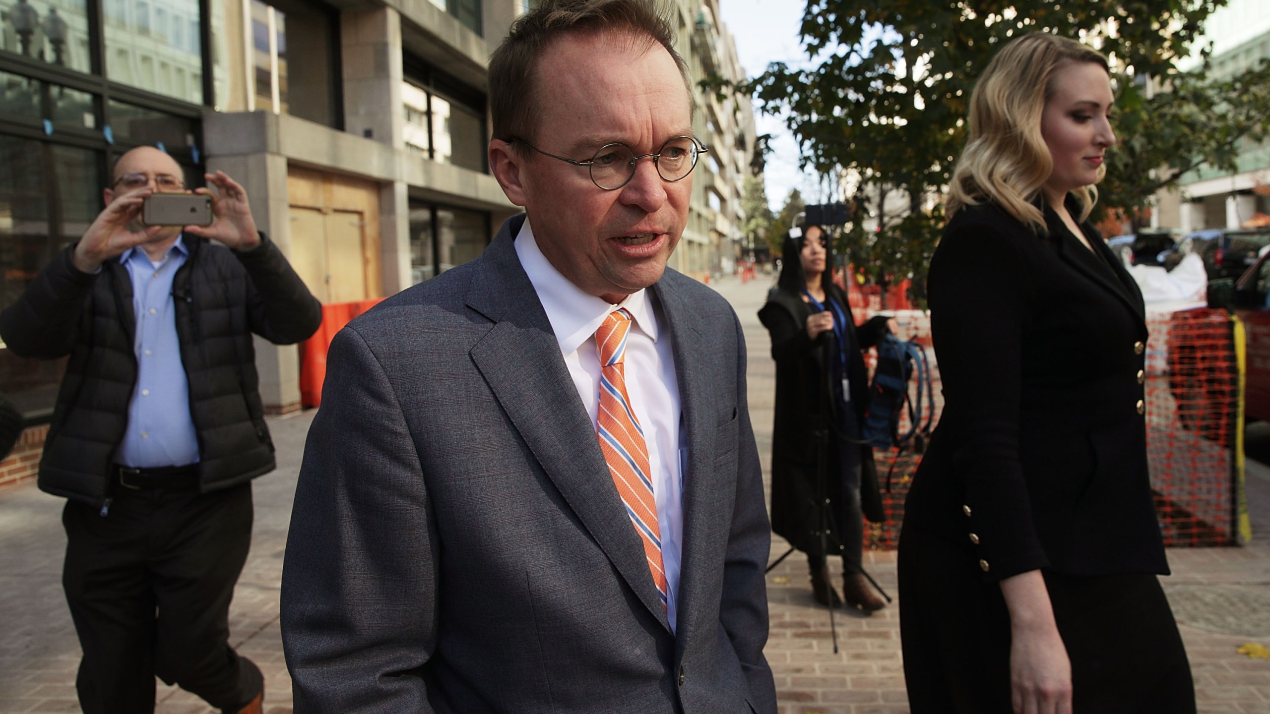 Mick Mulvaney walks back to the White House from the CFPB building after he showed up for his first day of work on Nov. 27, 2017 in Washington, D.C. (Credit: Alex Wong/Getty Images)