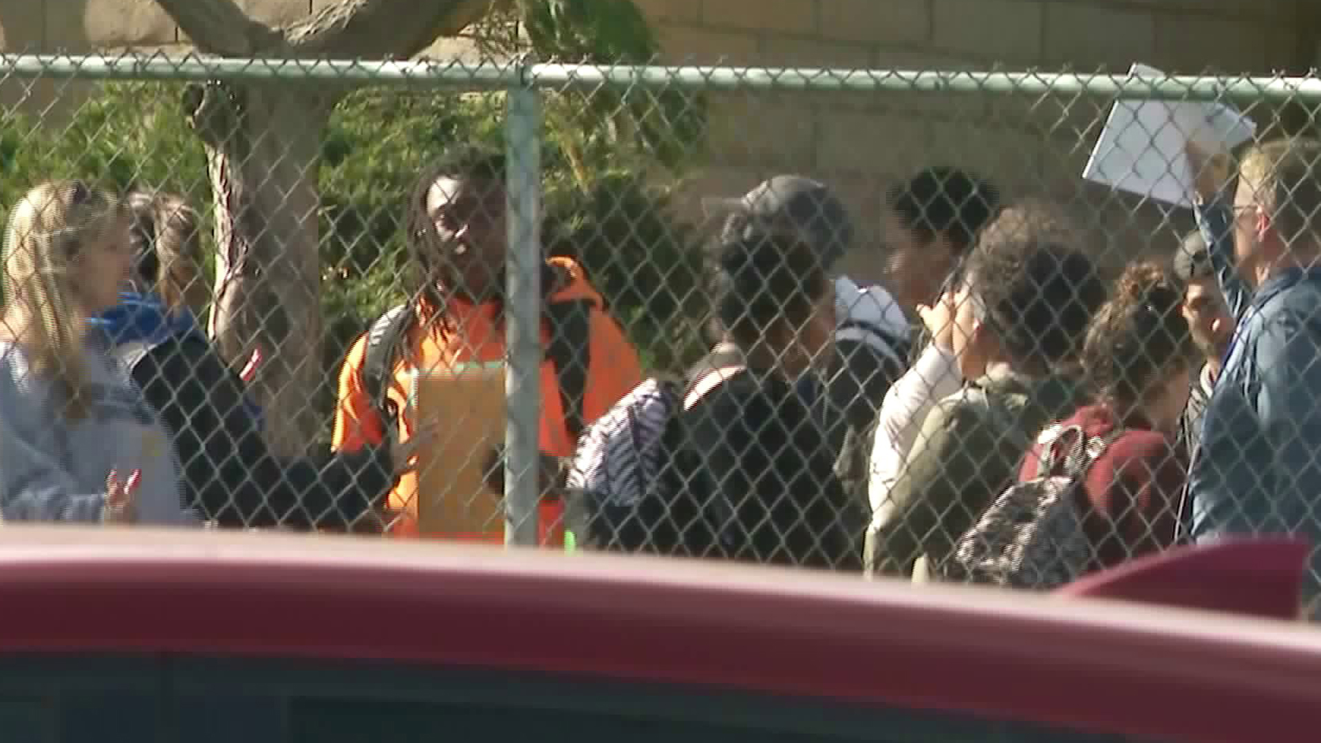 Students are seen leaving Serrano High School in Phelan on Nov. 17, 2017, just as outrage over some students making racist gestures and statements as shook the campus. (Credit: KTLA)