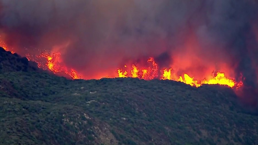 Flames rise from the Thomas Fire on Dec. 7, 2017. (Credit: KTLA)