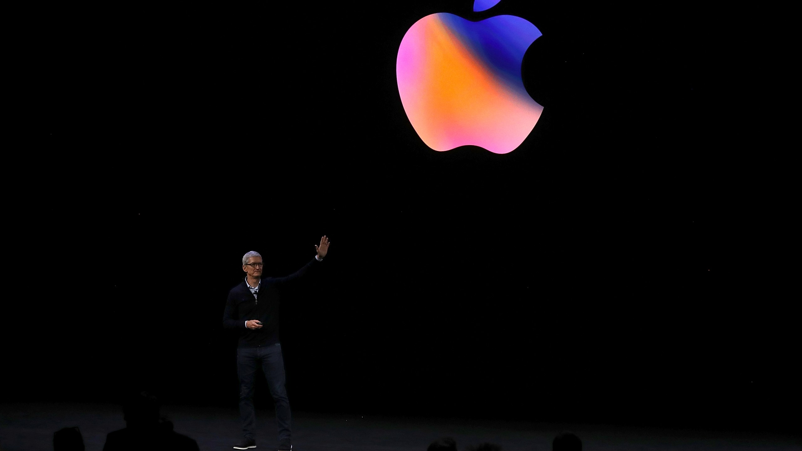 Apple CEO Tim Cook waves to the audience during an Apple event at the Steve Jobs Theatre on the Apple Park campus on Sept. 12, 2017 in Cupertino. (Credit: Justin Sullivan/Getty Images)