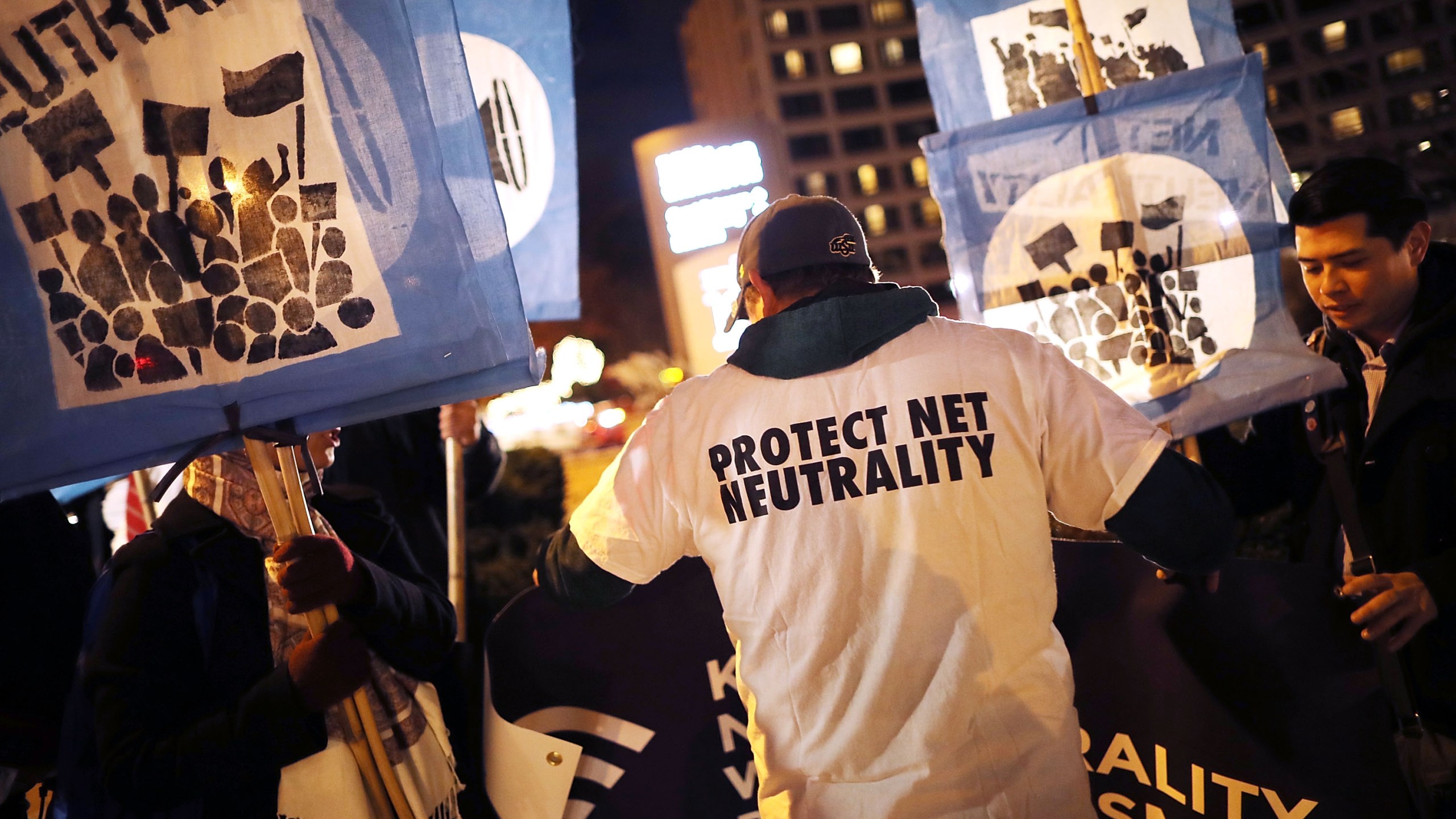 About 60 demonstrators gather outside of the 31st Annual Chairman's Dinner to show their support for net neutrality at the Washington Hilton December 7, 2017 in Washington, United States. (Credit: Chip Somodevilla/Getty Images)