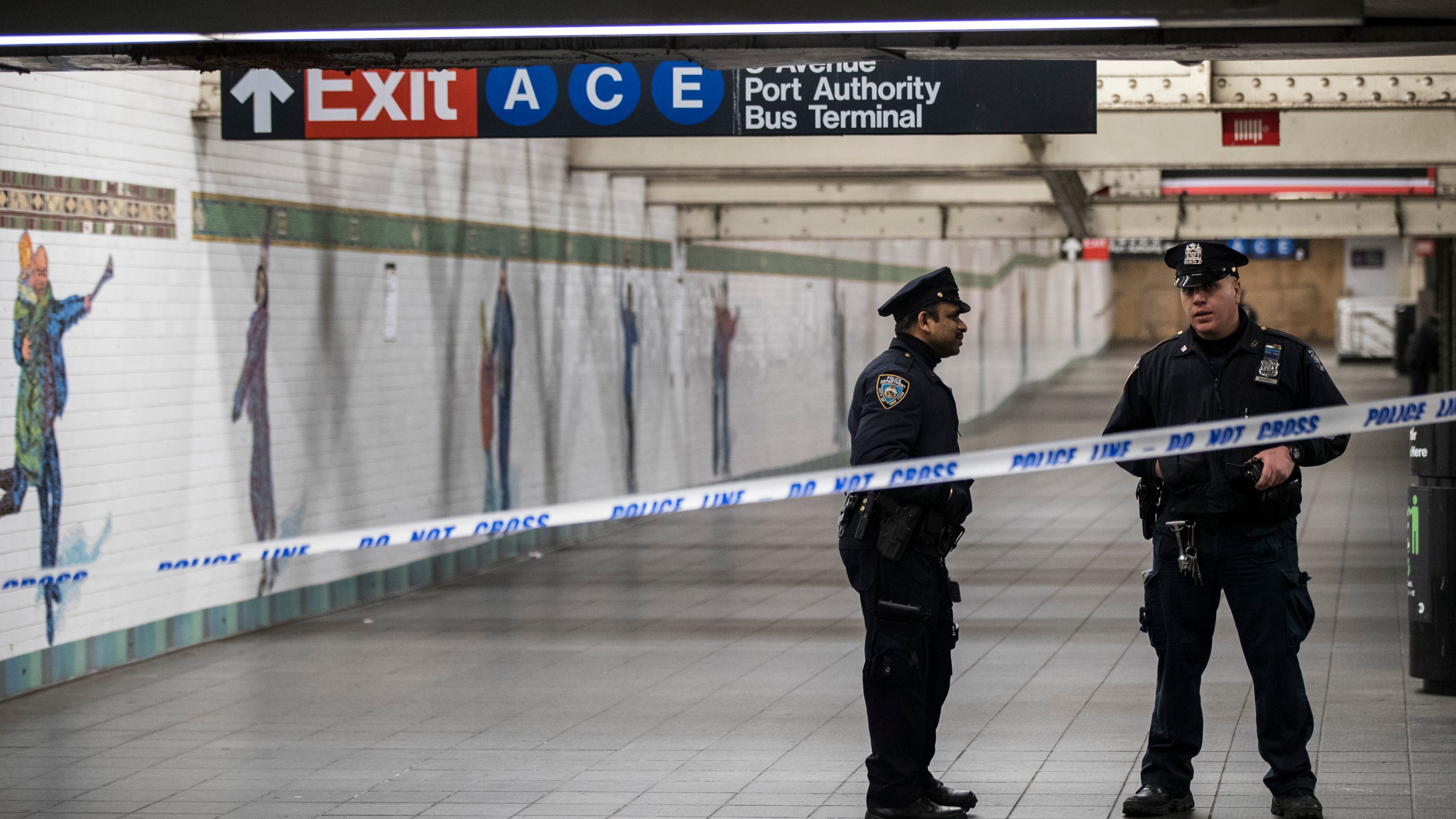 Police stand in a closed-off underground walkway near the site of a pipe bomb explosion in the tunnel that connects the Times Square subway station to the Port Authority Bus Terminal, Dec. 11, 2017, in New York City. (Credit: Drew Angerer/Getty Images)