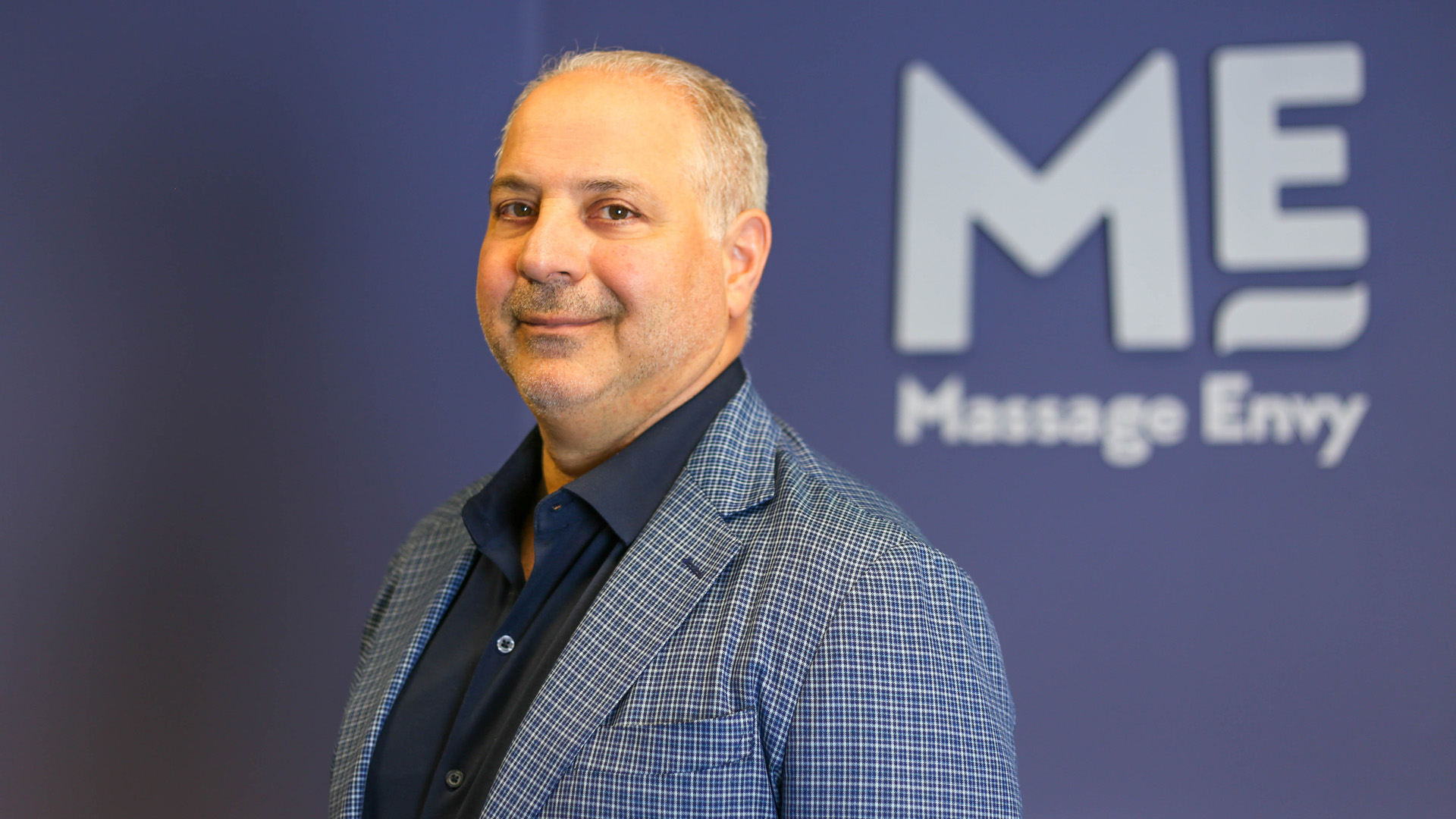 Massage Envy CEO Joe Magnacca appears in an undated photo provided by the company to KTLA.