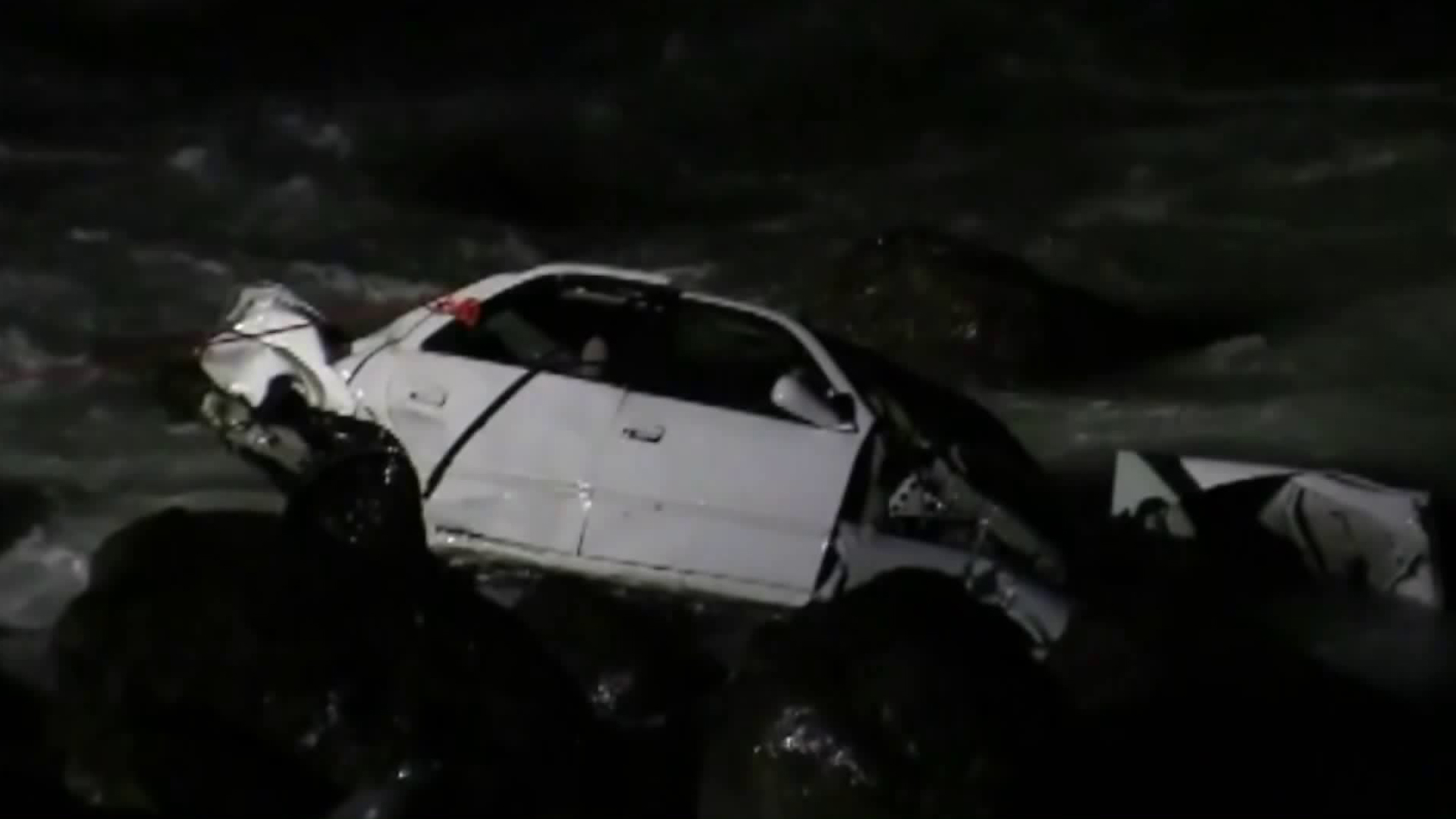 One person died after a car went off the side of the Pacific Coast Highway and crashed into the rocks below on Jan. 23, 2018. (Credit: KTLA)