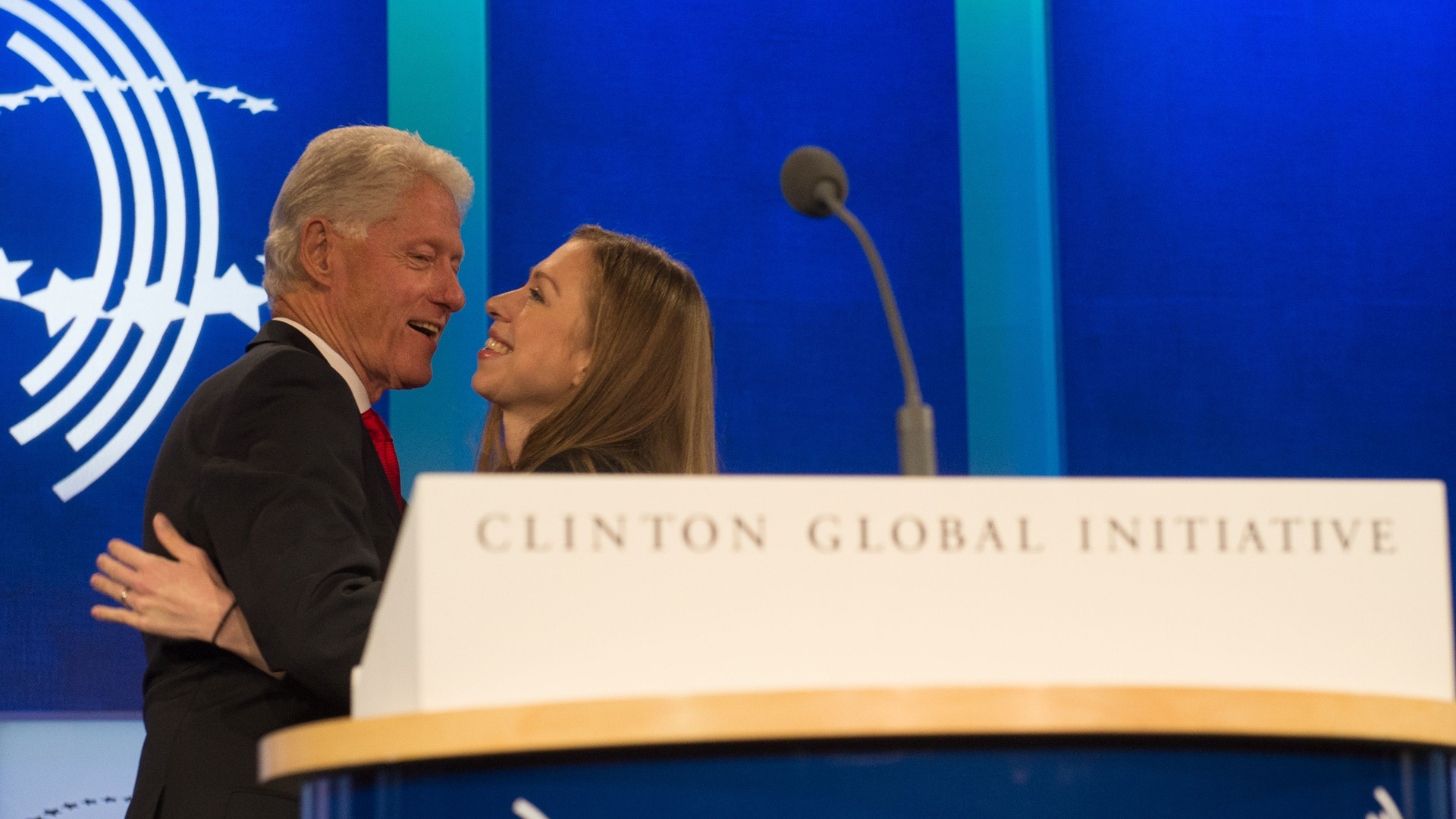 Former President and Founding Chairman of the Clinton Global Initiative Bill Clinton, embraces Clinton Foundation Vice Chair and his daughter, Chelsea Clinton, at the closing Plenary Session: "Imagine All The People" at the Clinton Global Initiative, on Sept., 21, 2016, in New York. (Credit: Bryan R. Smith /AFP/Getty Images)