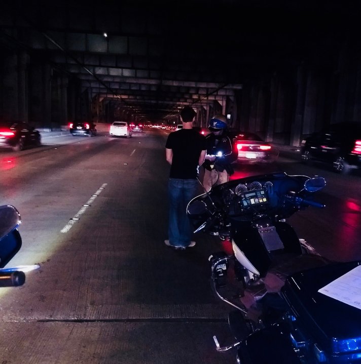 A Tesla driver suspected of drunken driving is seen being arrested on the Bay Bridge in San Francisco on Jan. 19, 2018, in a photo released by the California Highway Patrol.