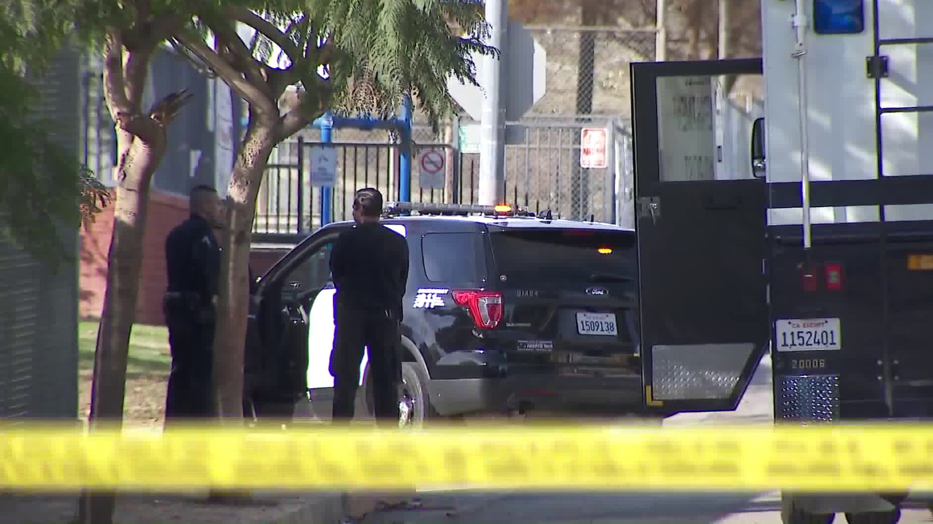 Officers hold down the scene of a police shooting in Montecito Heights on Jan. 14, 2018. (Credit: KTLA)