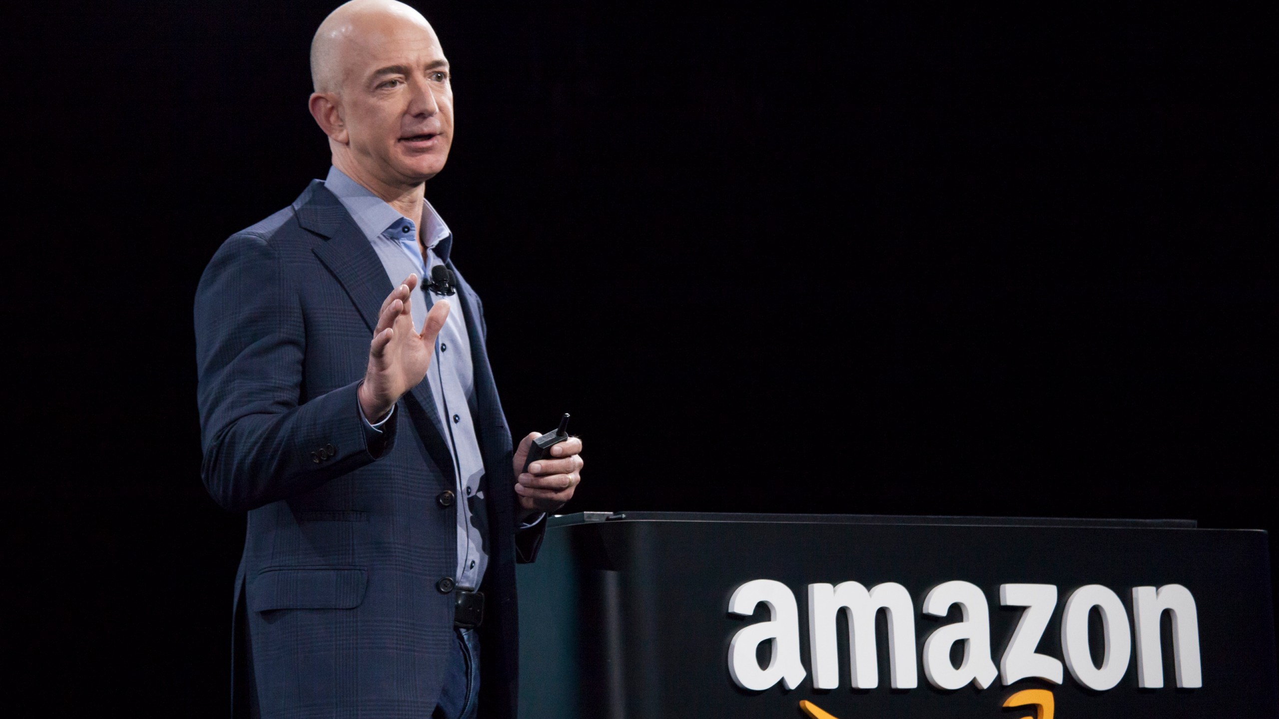 Amazon.com founder and CEO Jeff Bezos presents the company's first smartphone, the Fire Phone, on June 18, 2014 in Seattle, Washington. (Credit: David Ryder/Getty Images)