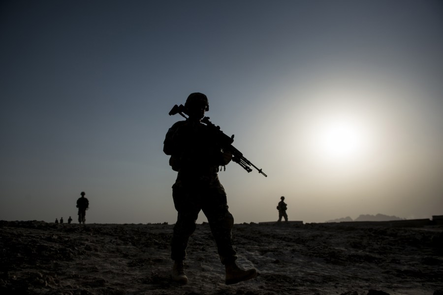 U.S. soldiers patrol near Kandahar Airfield on June 3, 2014. (Credit: BRENDAN SMIALOWSKI/AFP/Getty Images)