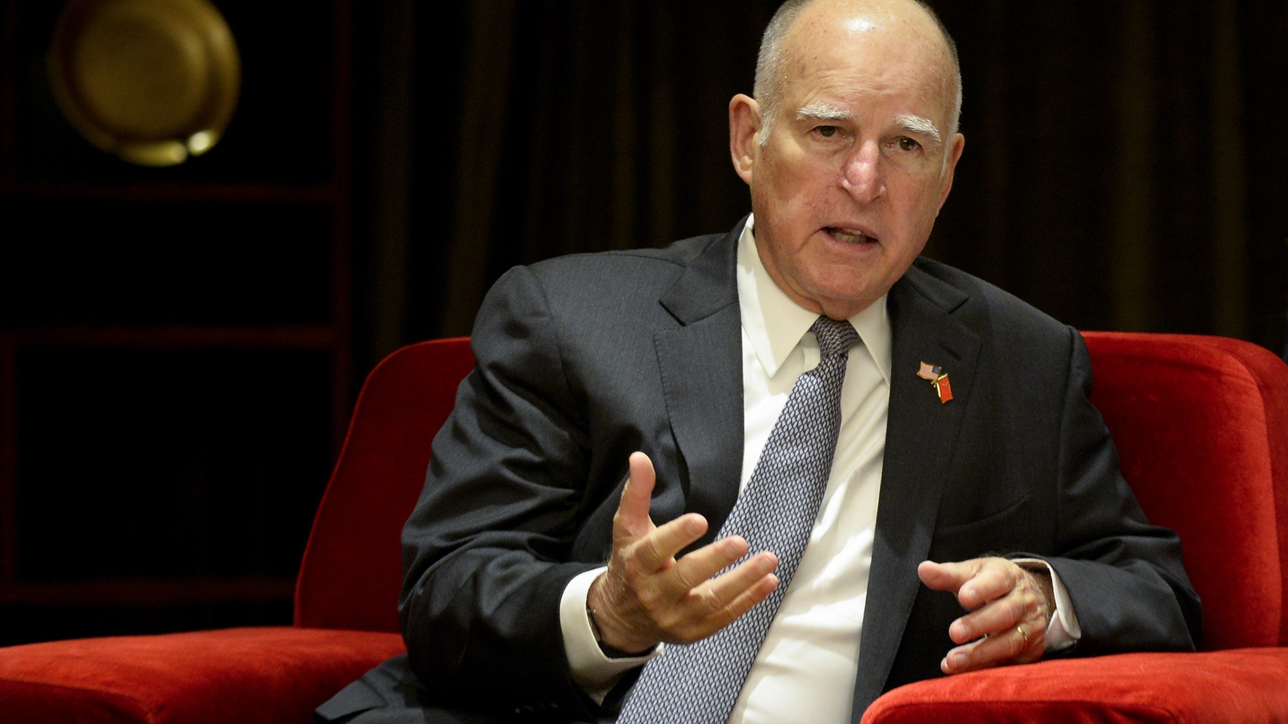 California Governor Jerry Brown speaks with Chinese Minister of Science and Technology Wan Gang (not pictured) during their meeting ahead of the Clean Energy Ministerial international forum in Beijing on June 6, 2017. (Credit: WANG ZHAO/AFP/Getty Images)