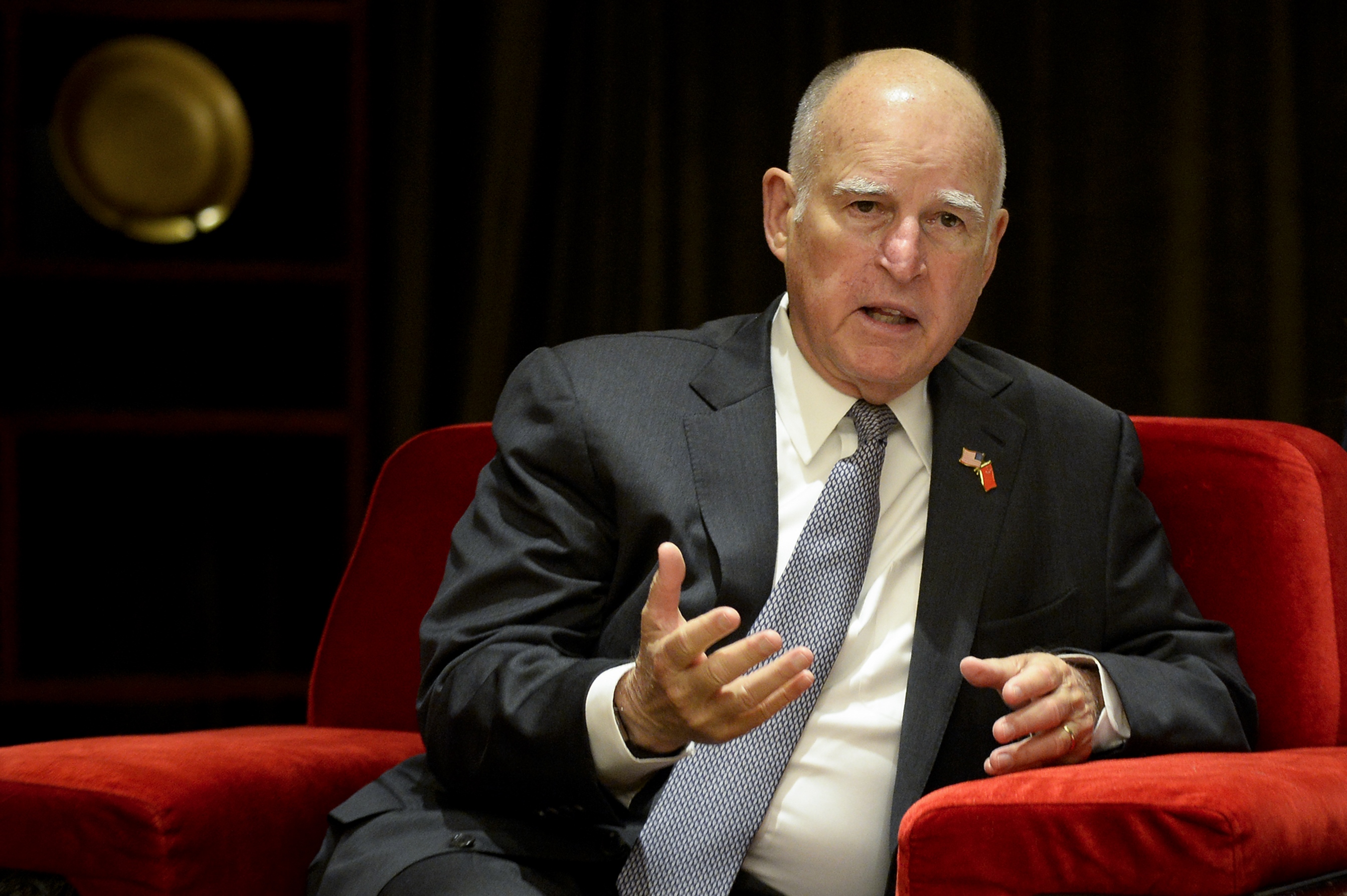 California Governor Jerry Brown speaks with Chinese Minister of Science and Technology Wan Gang (not pictured) during their meeting ahead of the Clean Energy Ministerial international forum in Beijing on June 6, 2017. (Credit: WANG ZHAO/AFP/Getty Images)