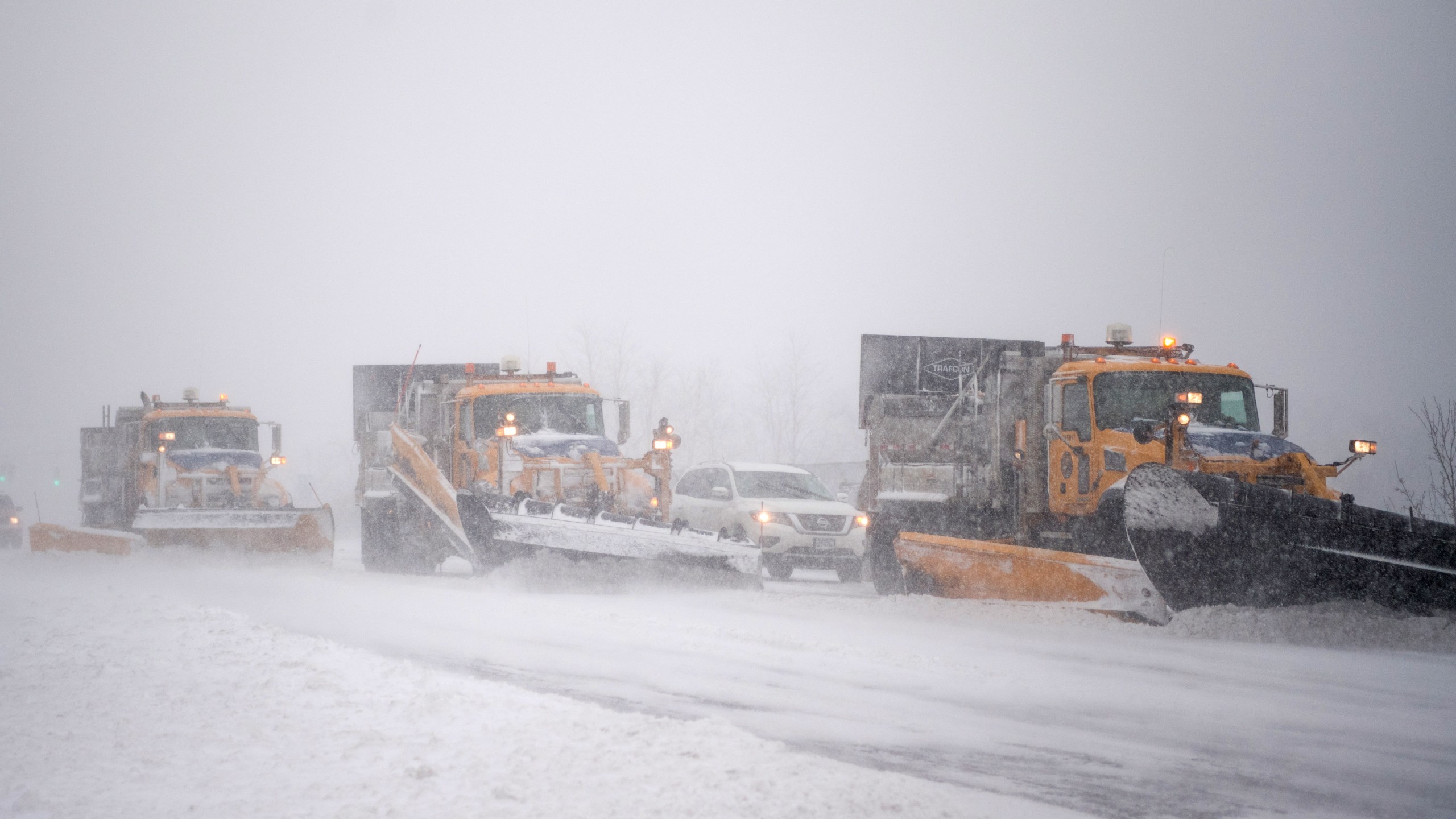 Trucks plow Rt. 112 as a blizzard hits the Northeastern part of the United States on Jan. 4, 2018 in Medford, New York. (Credit: Andrew Theodorakis/Getty Images)