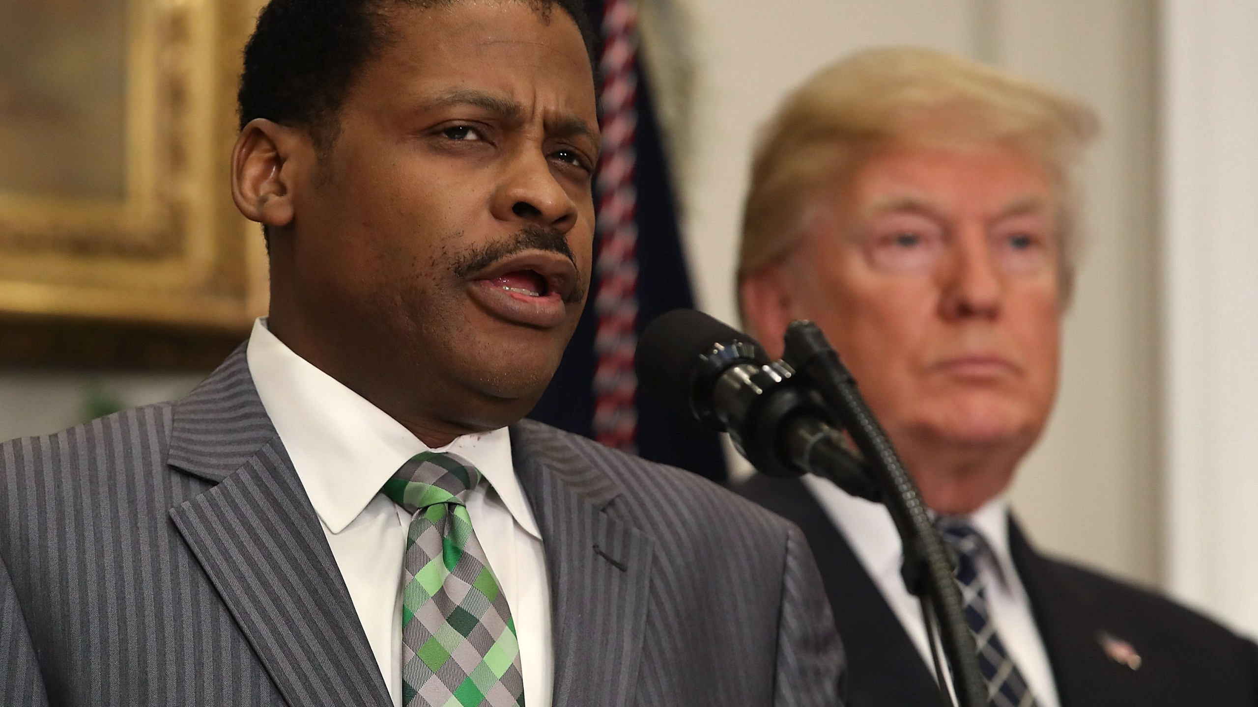 Isaac Newton Farris, Jr., left, speaks before President Donald Trump signed a proclamation to honor Martin Luther King, Jr. day, in the Roosevelt Room at the White House, on Jan. 12, 2018. (Credit: Mark Wilson / Getty Images)