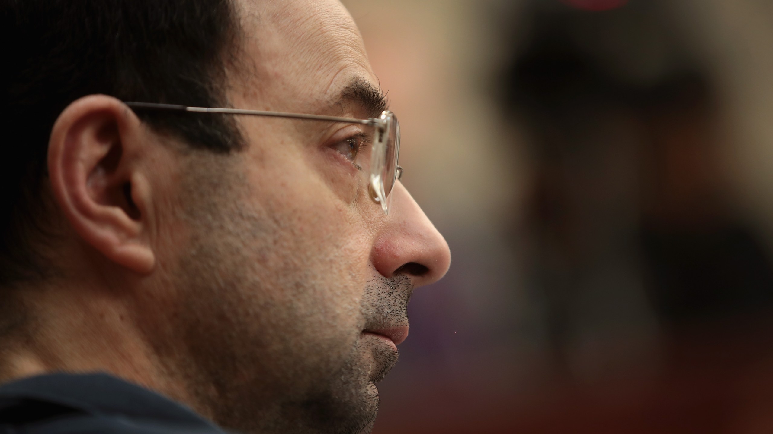 Larry Nassar listens to victim impact statements on January 17, 2018 during his sentencing hearing after being accused of molesting more than 100 girls while he was a physician for USA Gymnastics and Michigan State University. (Credit: Scott Olson/Getty Images)