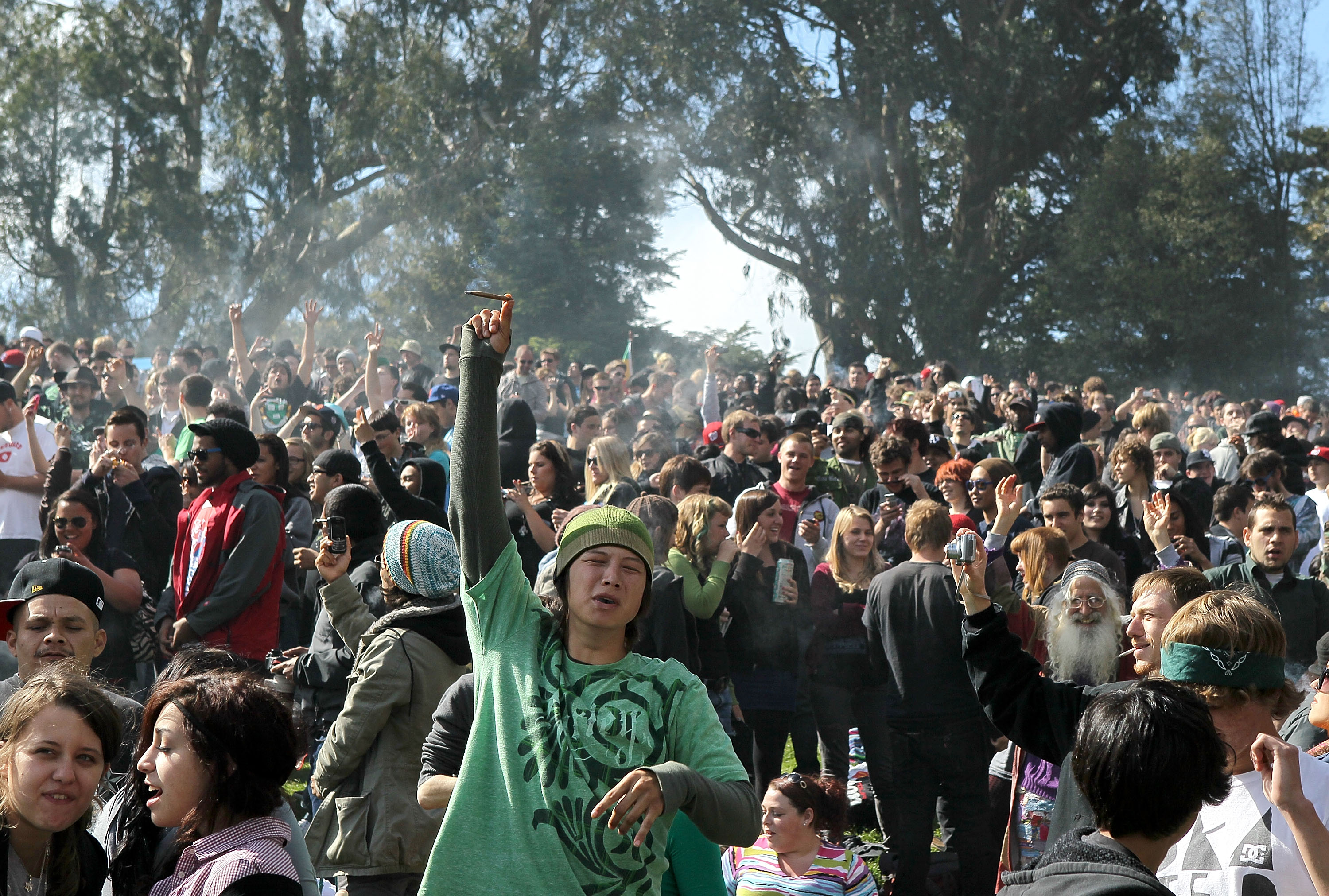 A cloud of smoke rests over the heads of a group of people during a 420 Day celebration on "Hippie Hill" in Golden Gate Park April 20, 2010, in San Francisco. (Credit: Justin Sullivan/Getty Images)