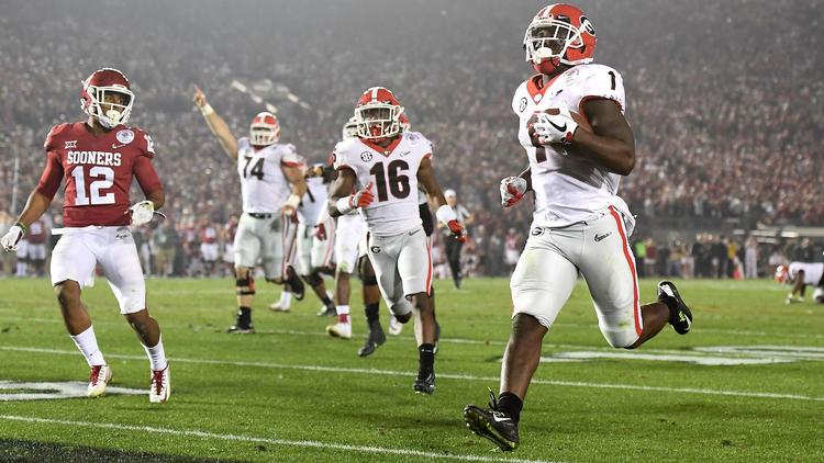 Georgia running back Sony Michel scores the game-winning touchdown in the second overtime of the College Football Playoff semifinal on Monday at the Rose Bowl. (Credit: Wally Skalij / Los Angeles Times)