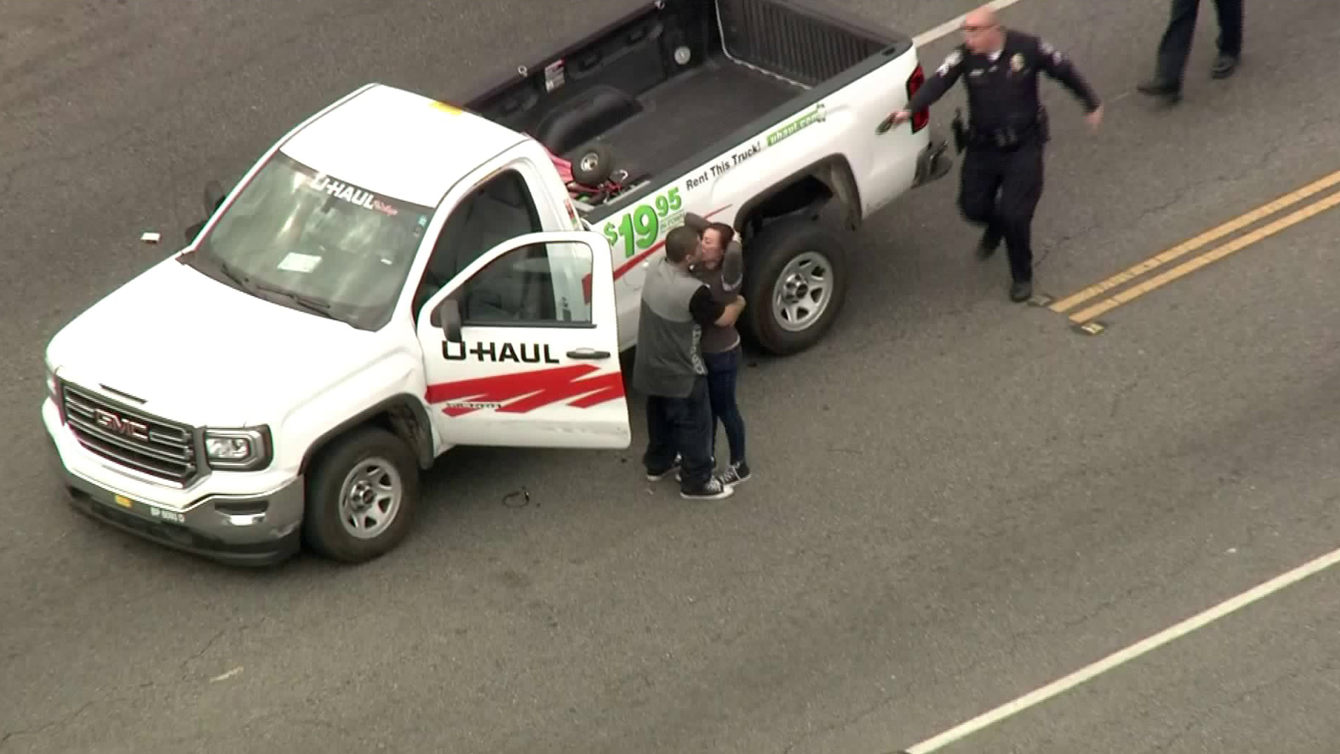 The passenger kisses the driver at the end of a pursuit in Montebello on Jan. 3, 2018. (Credit: KTLA)