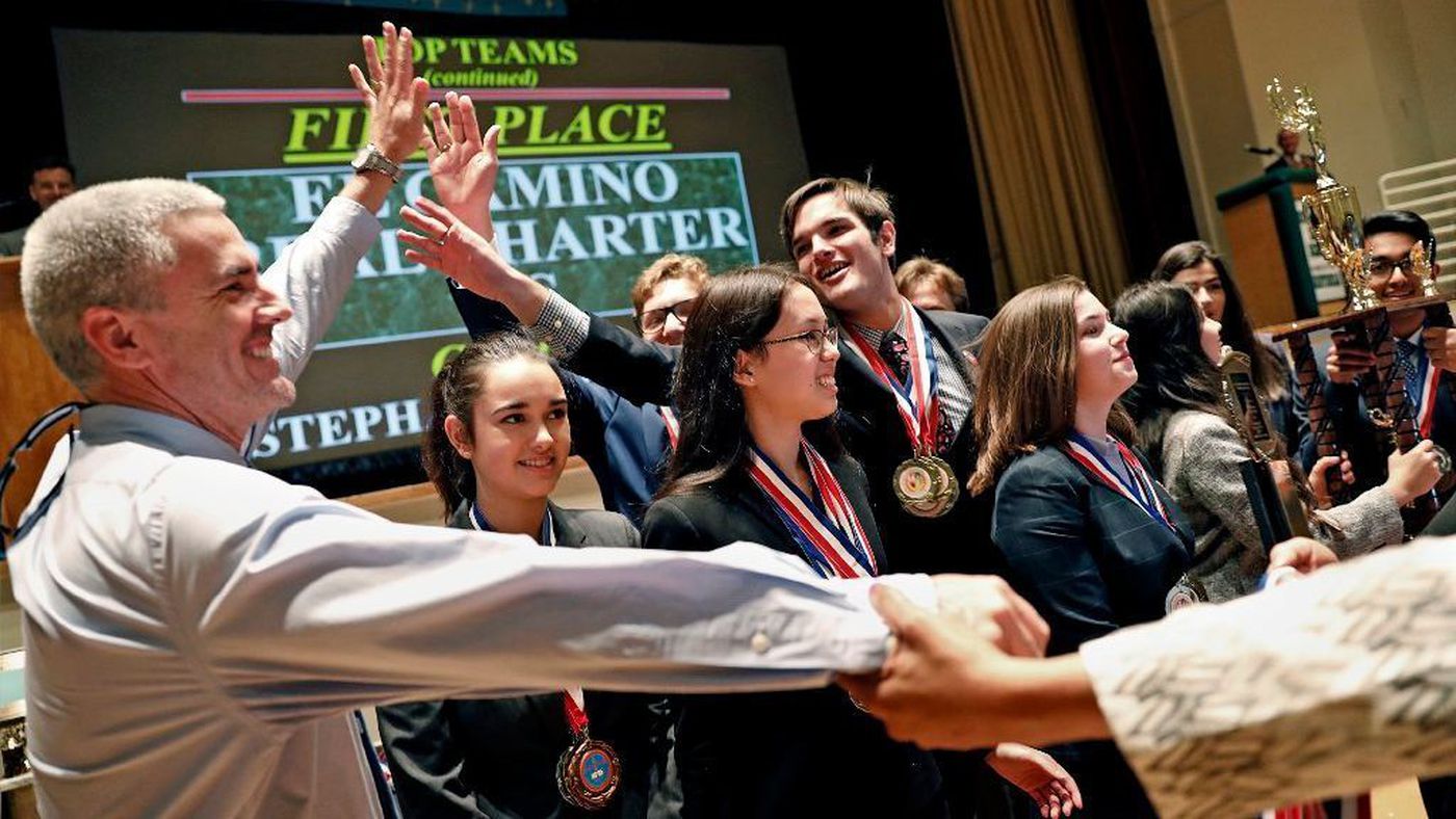 El Camino Real Charter High School students celebrate with principal David Hussey, left, after winning the 2018 L.A. Unified School District Academic Decathlon at Belmont High School on Feb. 11, 2018. (Credit: Christina House / Los Angeles Times)