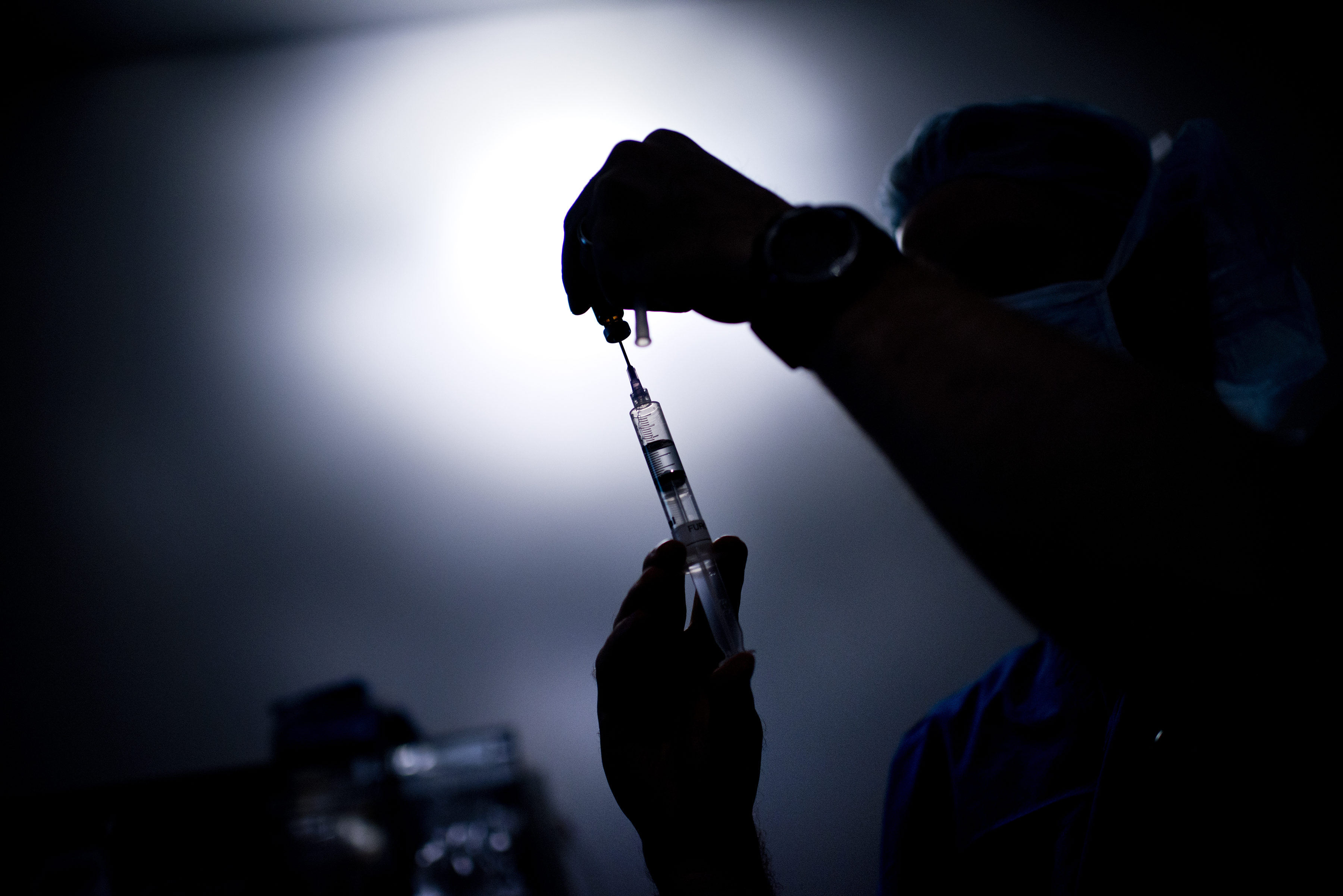 A doctor draws medicine into a syringe in this file photo. (Credit: BRENDAN SMIALOWSKI/AFP/GettyImages)