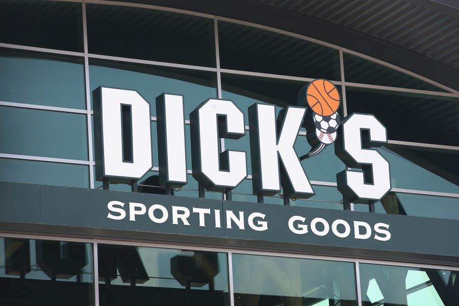 A sign with the company logo hangs above the entrance of a Dick's Sporting Goods store on May 20, 2014 in Niles, Illinois. (Credit: cott Olson/Getty Images)