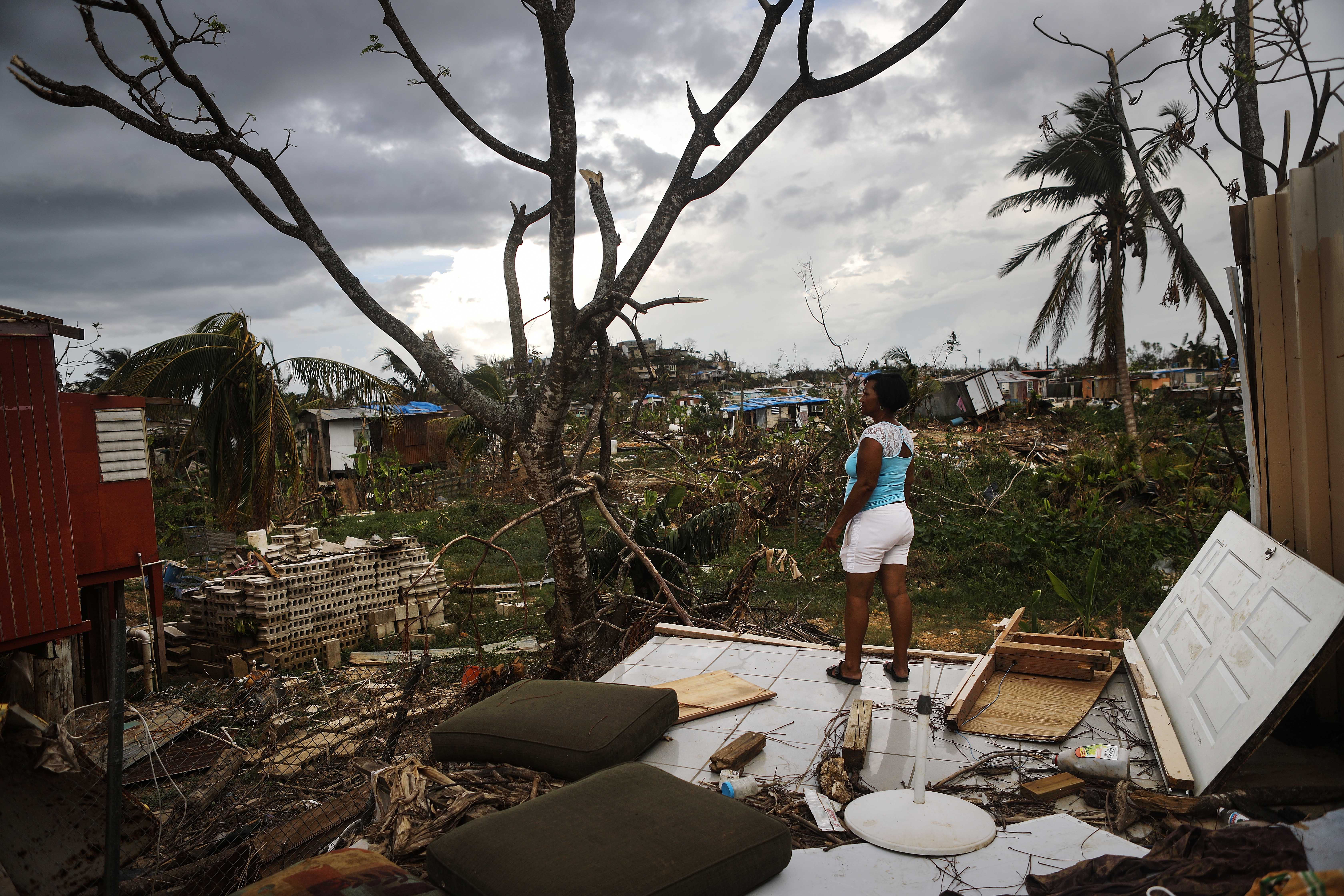 Resident Mirian Medina stands on her property about two weeks after Hurricane Maria swept through the island on Oct. 5, 2017 in San Isidro, Puerto Rico. (Credit: Mario Tama/Getty Images)