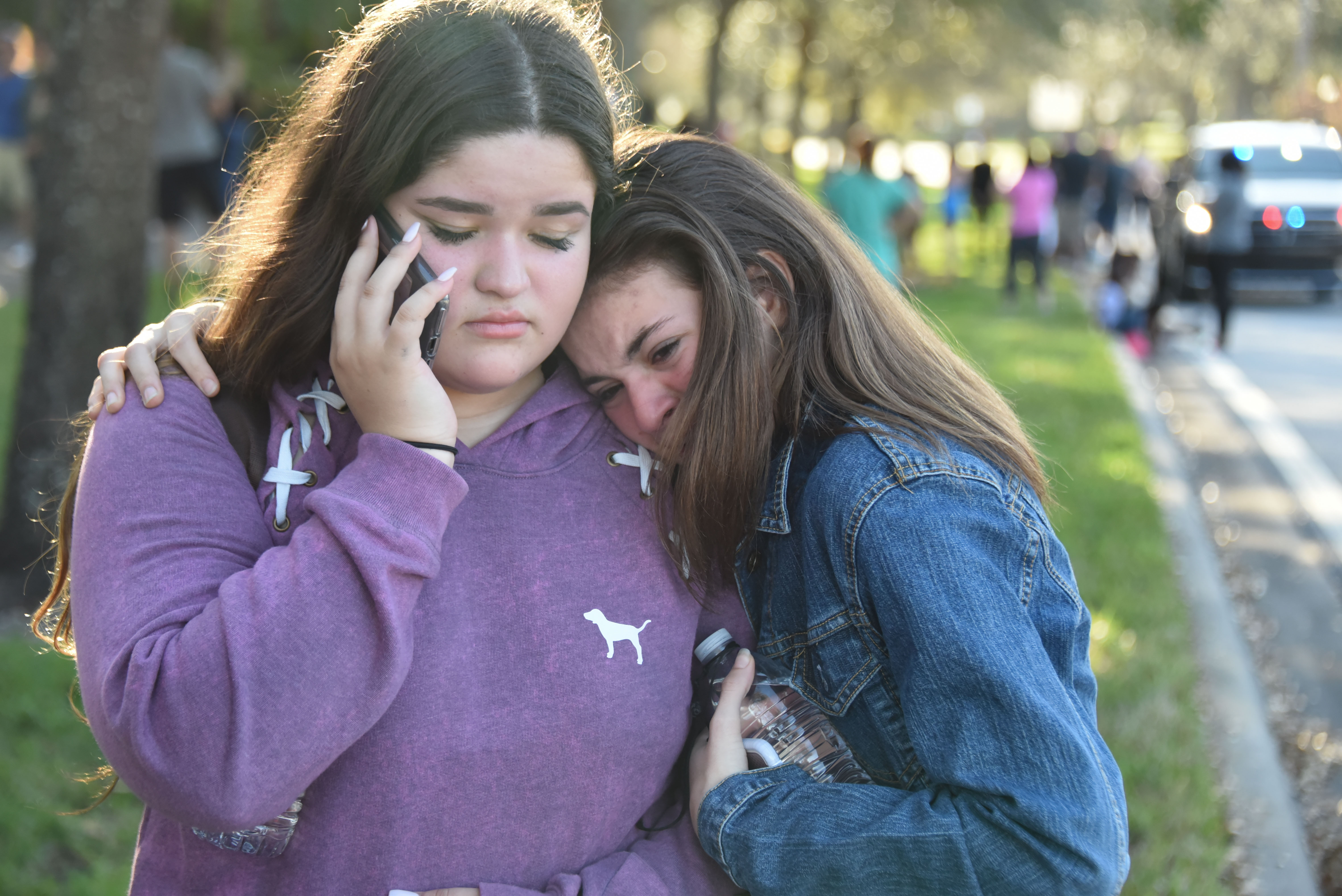 Students react following a shooting at Marjory Stoneman Douglas High School in Parkland, Florida, on Feb. 14, 2018. (Credit: MICHELE EVE SANDBERG/AFP/Getty Images)