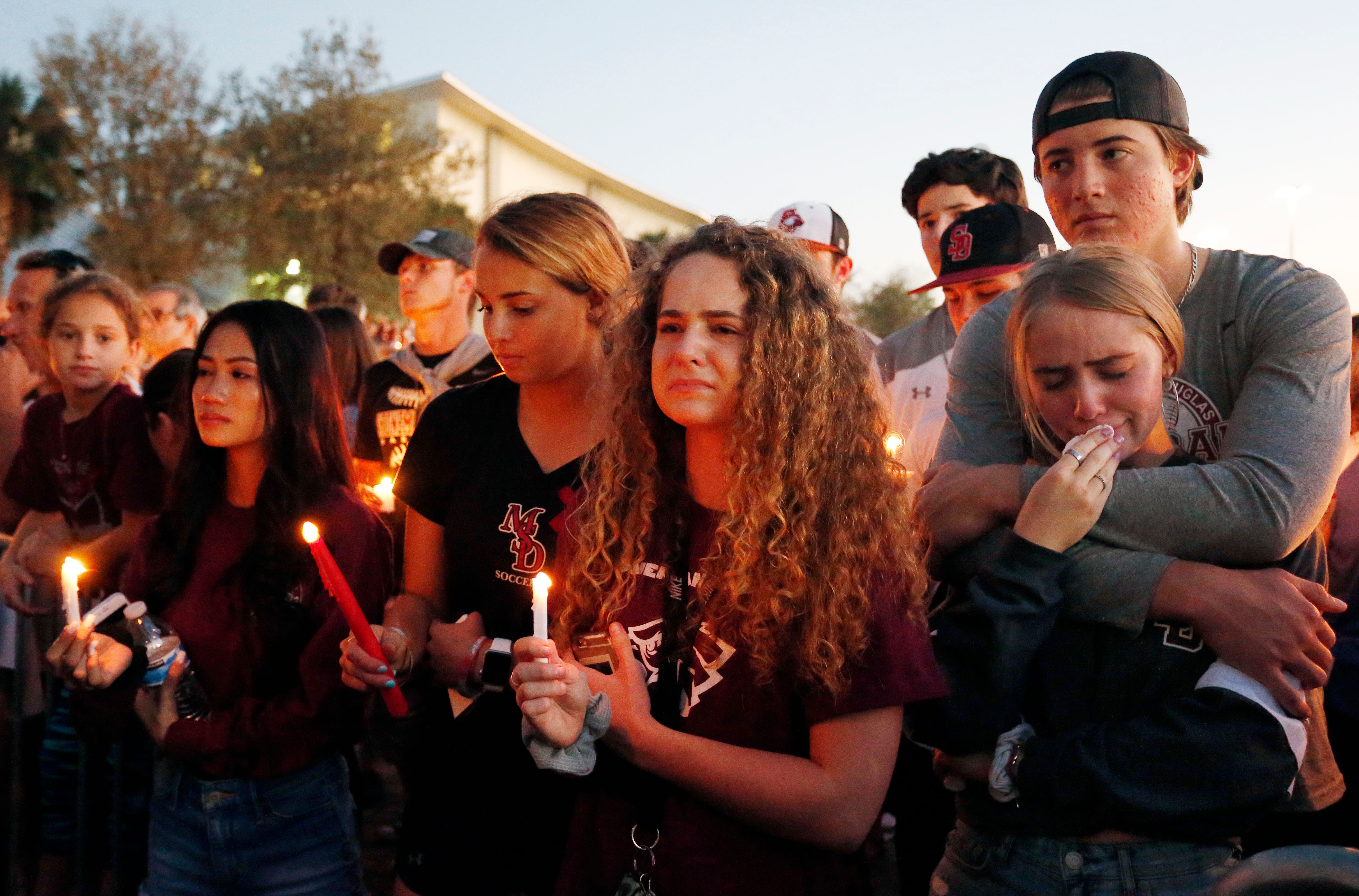 Mourners react during a candlelight vigil for the victims of Marjory Stoneman Douglas High School shooting in Parkland, Florida on Feb. 15, 2018. (Credit: RHONA WISE/AFP/Getty Images)