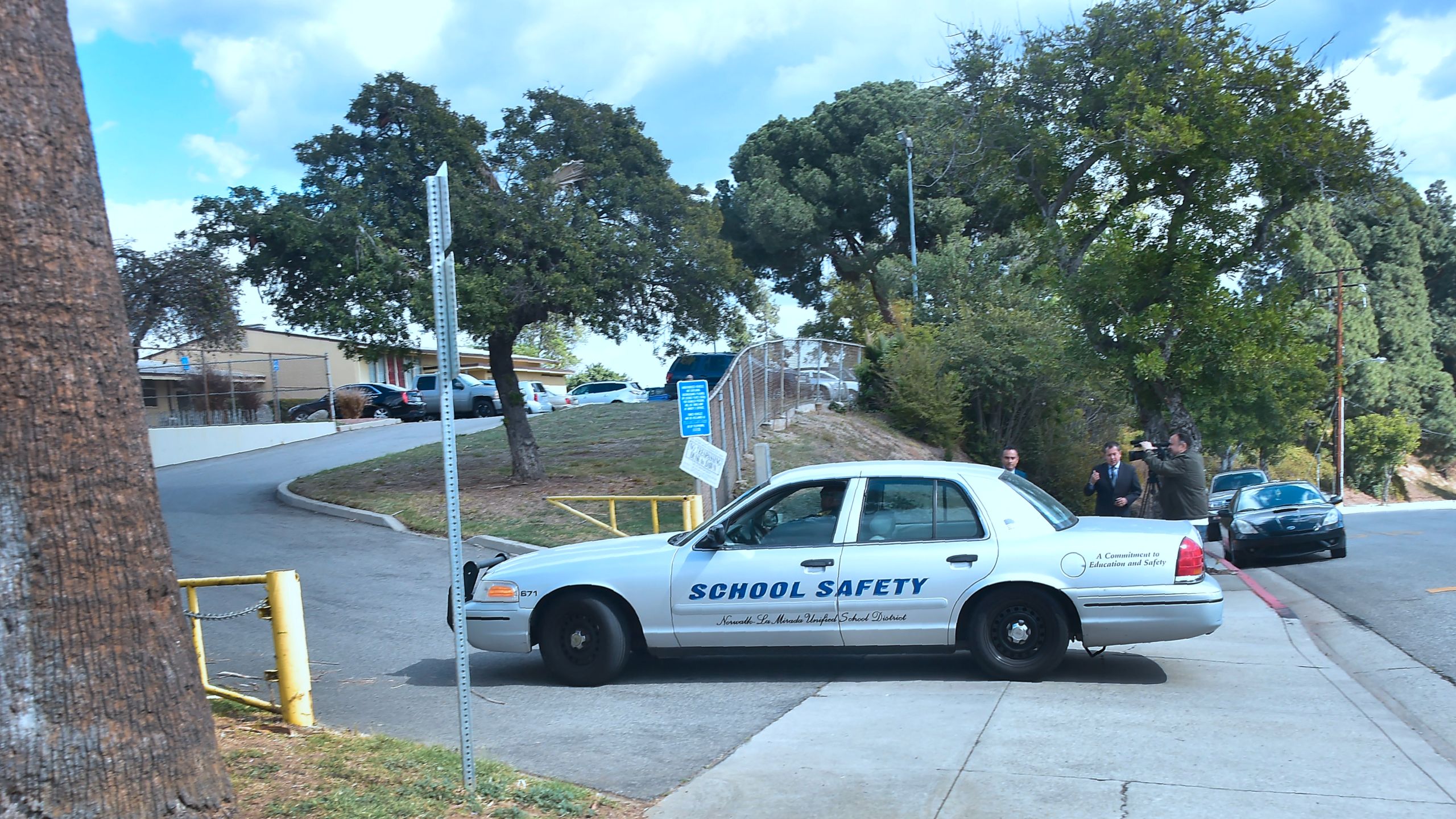 A driver in a school saftey vehicle makes his way to the campus of El Camino High School in South Whittier on Feb. 21, 2018, after a threat by a student was overheard by a school safety officer. (Credit: Frederic J. Brown / AFP / Getty Images)