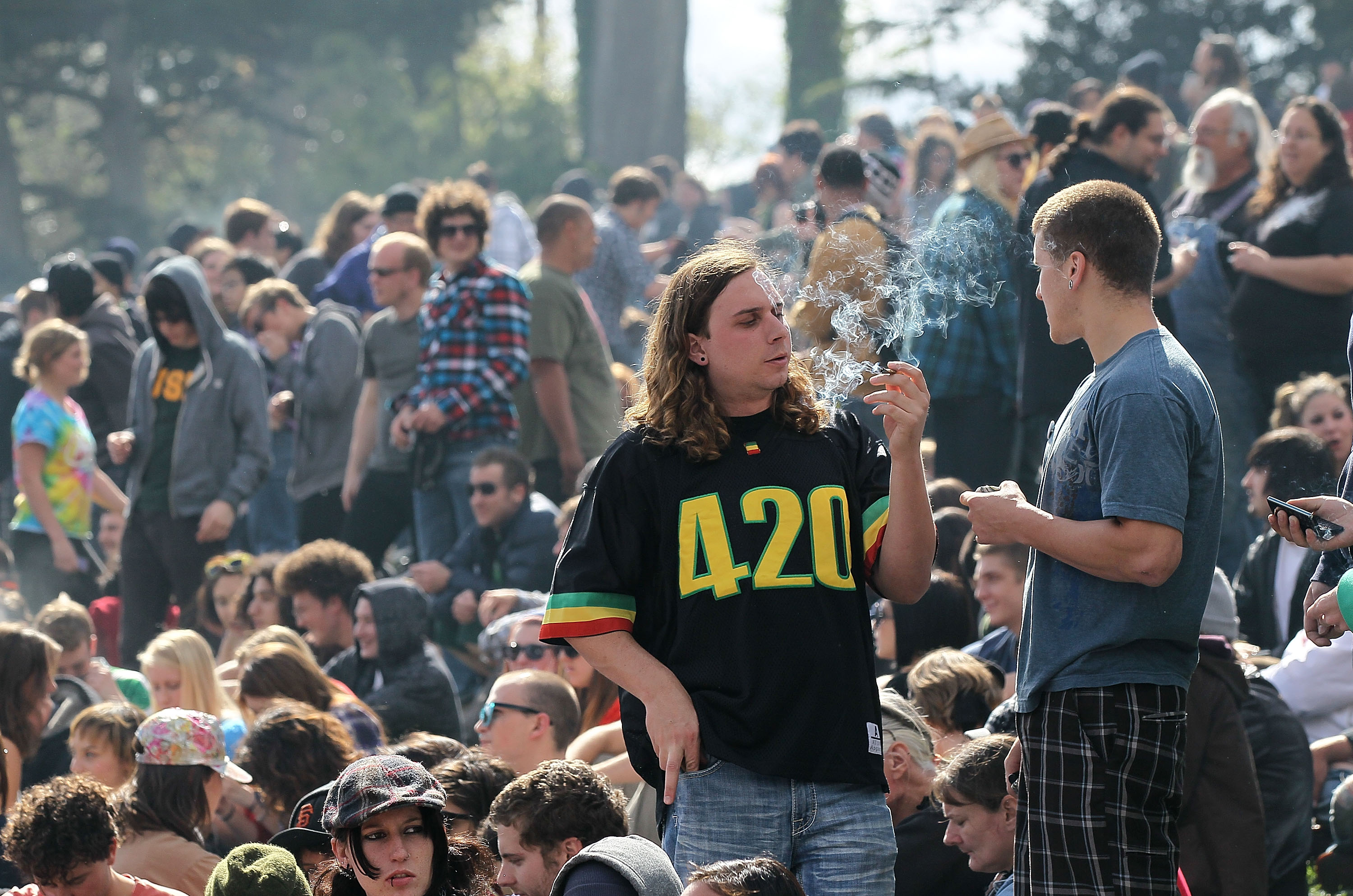 A man user smokes marijuana during a 420 Day celebration on "Hippie Hill" in San Francisco's Golden Gate Park, April 20, 2010. (Credit: Justin Sullivan / Getty Images)