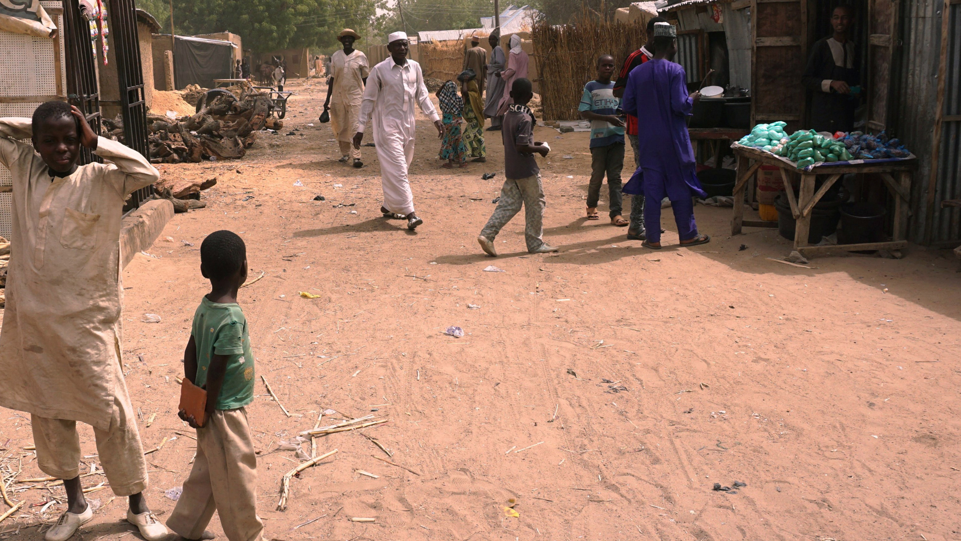 Residents walk along a street in Dapchi, Nigeria, on Feb. 22, 2018. School girls from Dapchi's Government Girls Science and Technical College were reportedly kidnapped by Boko Haram.(Credit: AMINU ABUBAKAR/AFP/Getty Images)