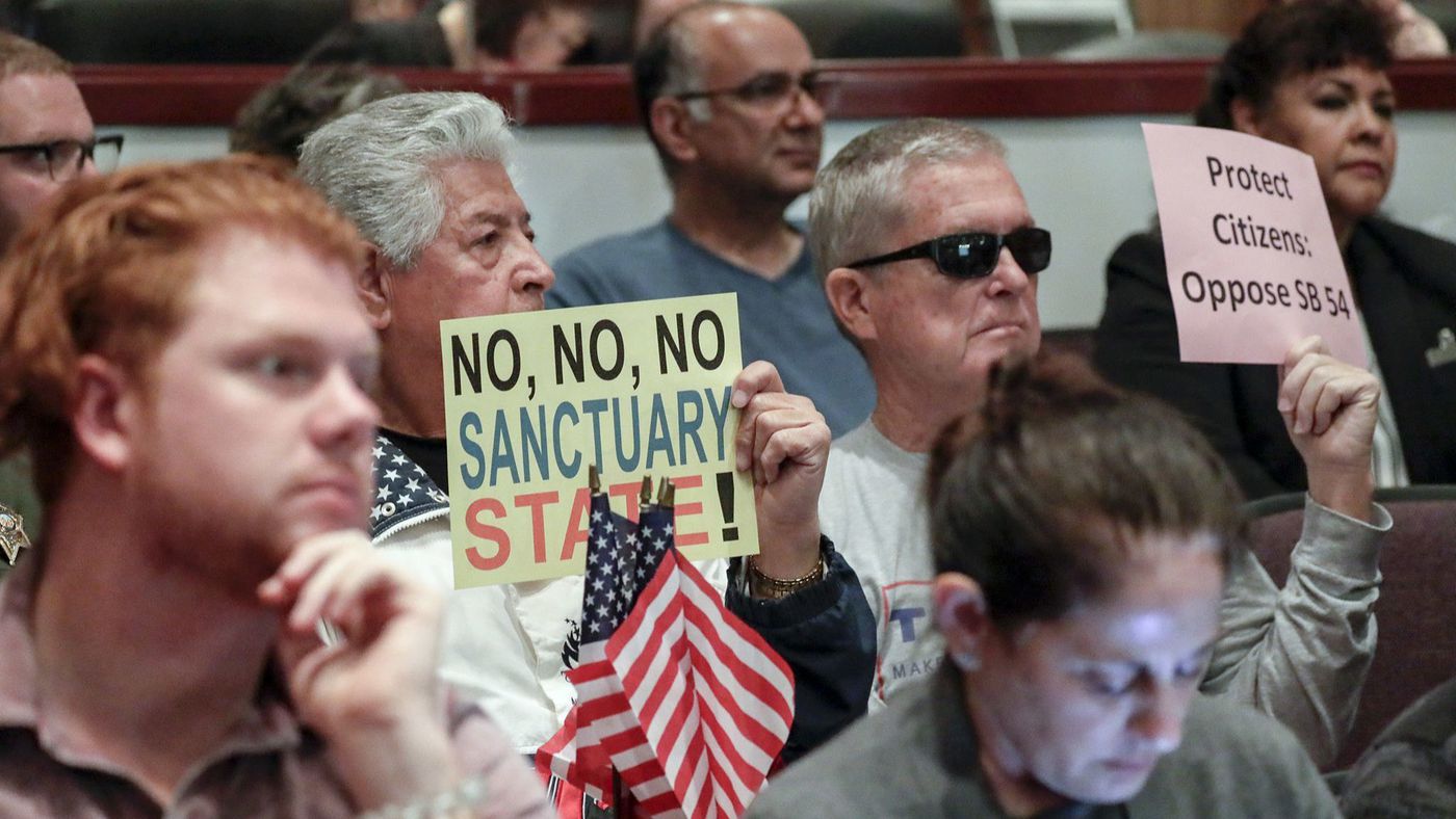 People opposing "sanctuary state" attend the Orange County Board of Supervisors meeting in Santa Ana on March 27, 2018. (Credit: Irfan Khan / Los Angeles Times)