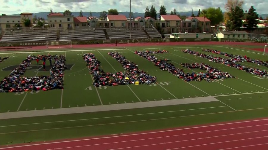 Students spell out "ENOUGH" at Granada Hills Charter High on March 14, 2018. (Credit: KTLA)