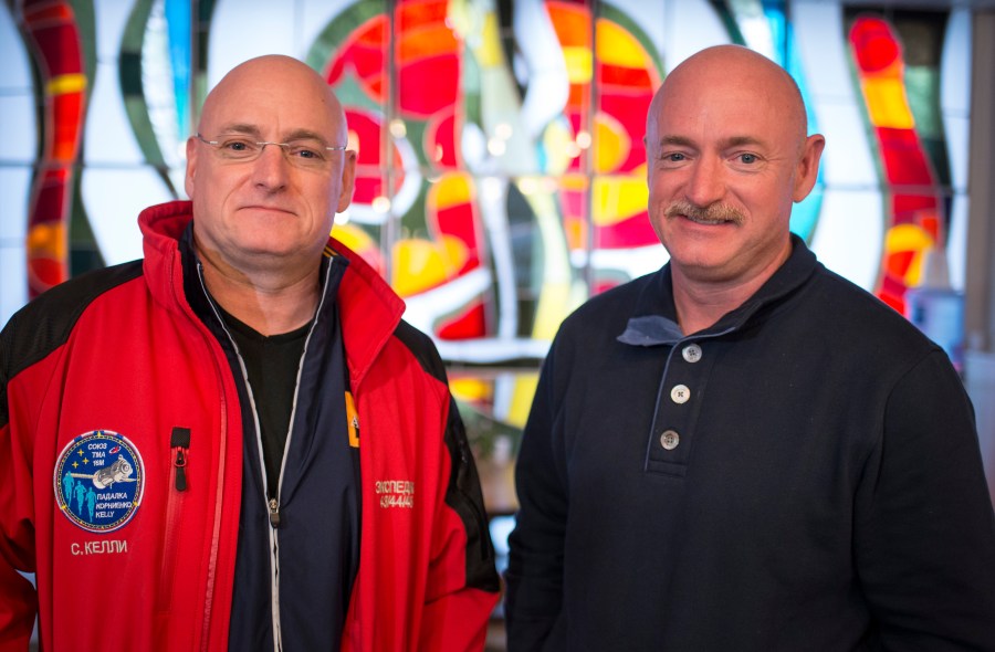 Expedition 43 NASA Astronaut Scott Kelly, left, and his identical twin brother Mark Kelly, pose for a photograph March 26, 2015, at the Cosmonaut Hotel in Baikonur, Kazakhstan. (Credit: Bill Ingalls/NASA via Getty Images)