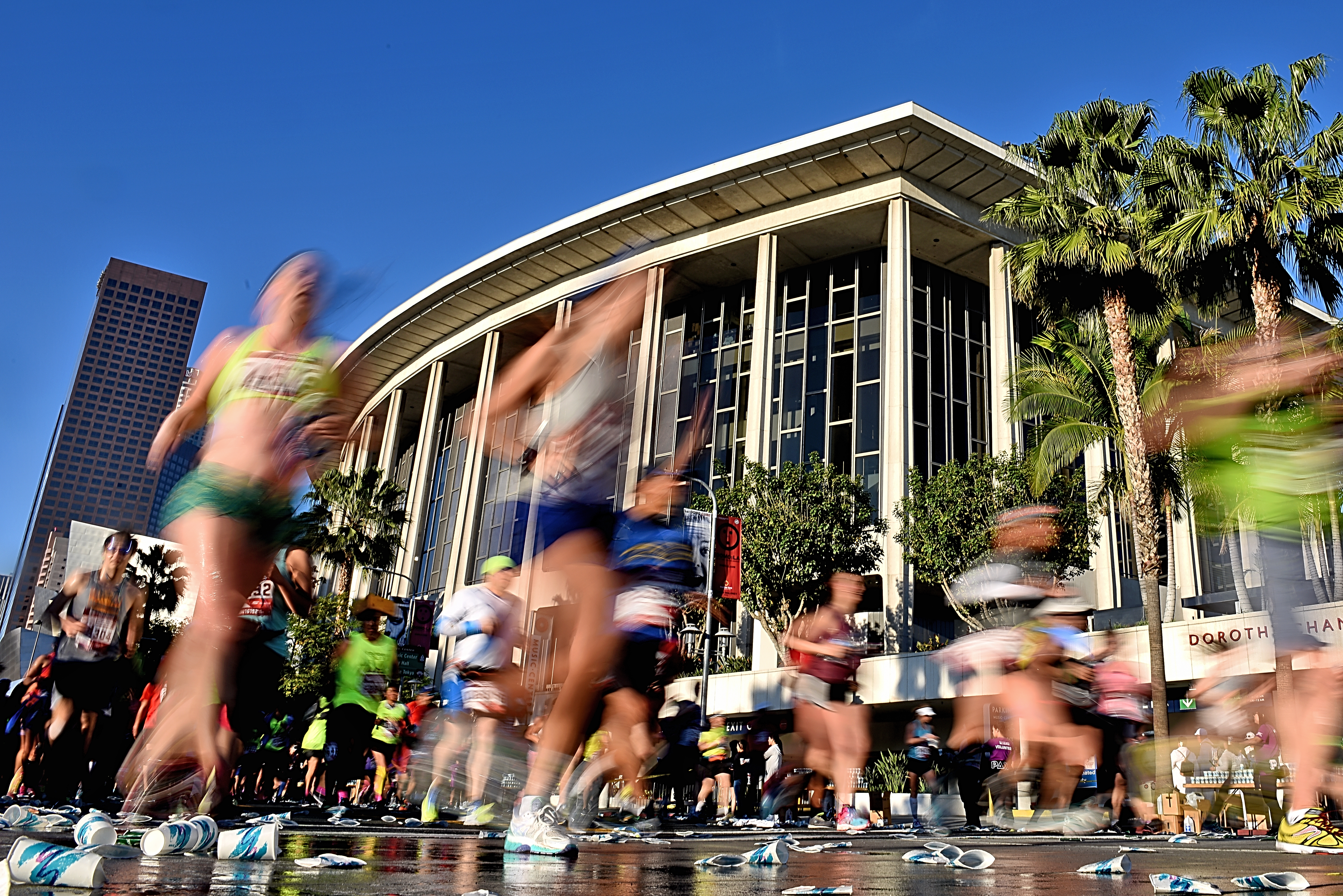 Runners stream past the Dorothy Chandler Pavilion and the Los Angeles Music Center during the 2016 Skechers Performance Los Angeles Marathon on Feb. 14, 2016. (Credit: Jonathan Moore / Getty Images)