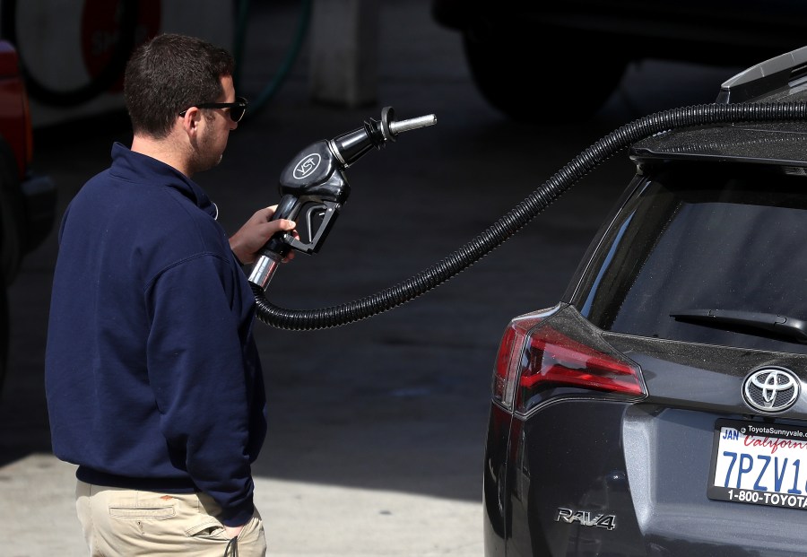 A customer prepares to pump gasoline into his car at a gas station on May 10, 2017, in San Anselmo. (Credit: Justin Sullivan/Getty Images)